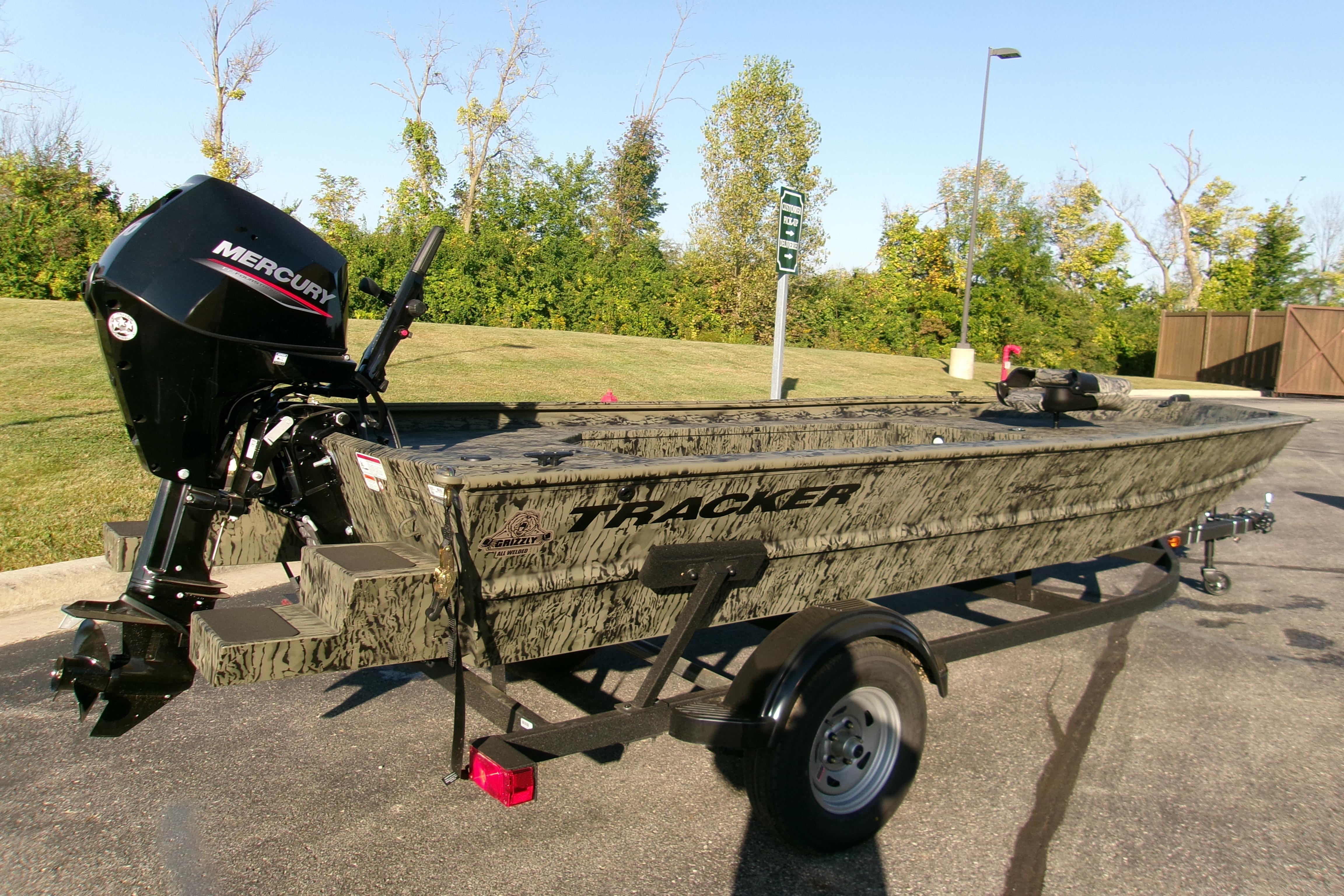 2026 Tracker Grizzly 1654 T Sportsman boat with Mercury engine on trailer.