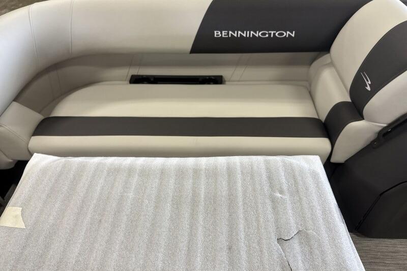 2026 Bennington 22 SSRSF boat interior seating, featuring sleek gray and black upholstery.