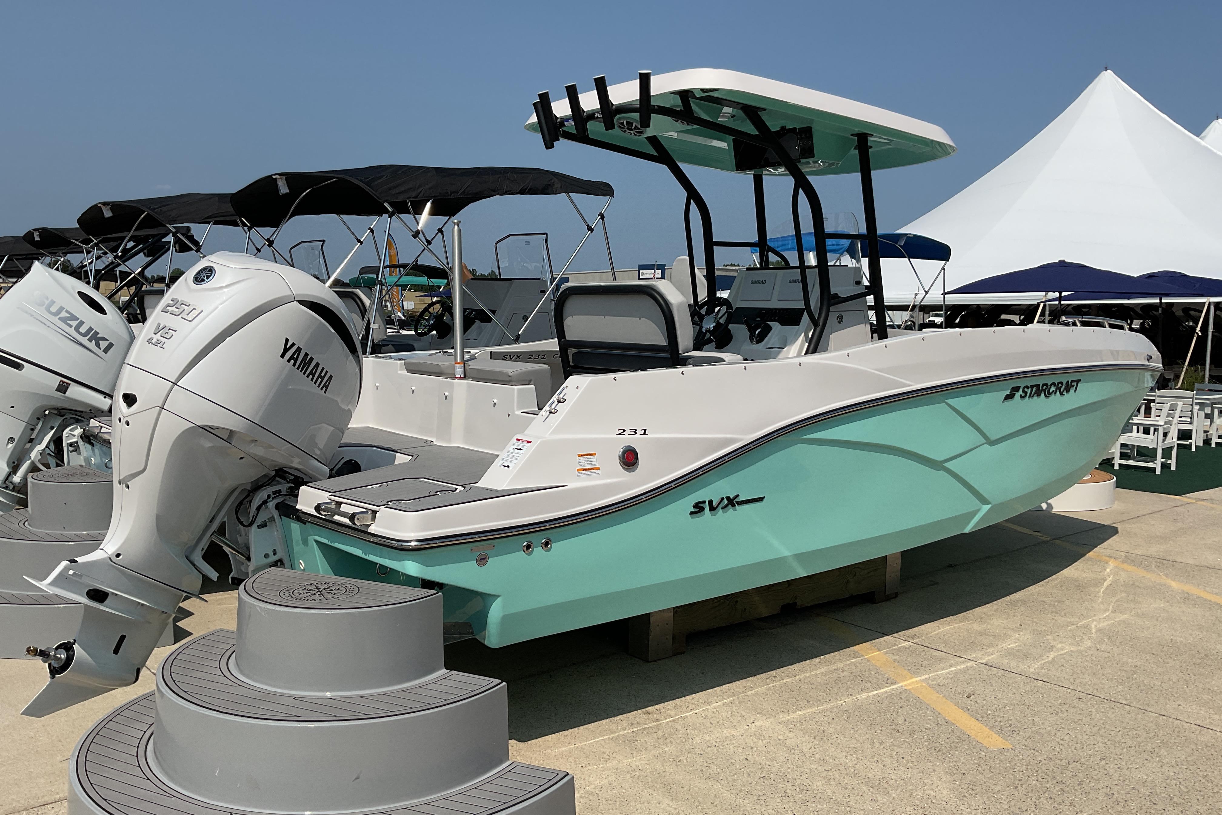 2026 Starcraft SVX 231 OB CC boat with Yamaha outboard motor displayed outdoors.