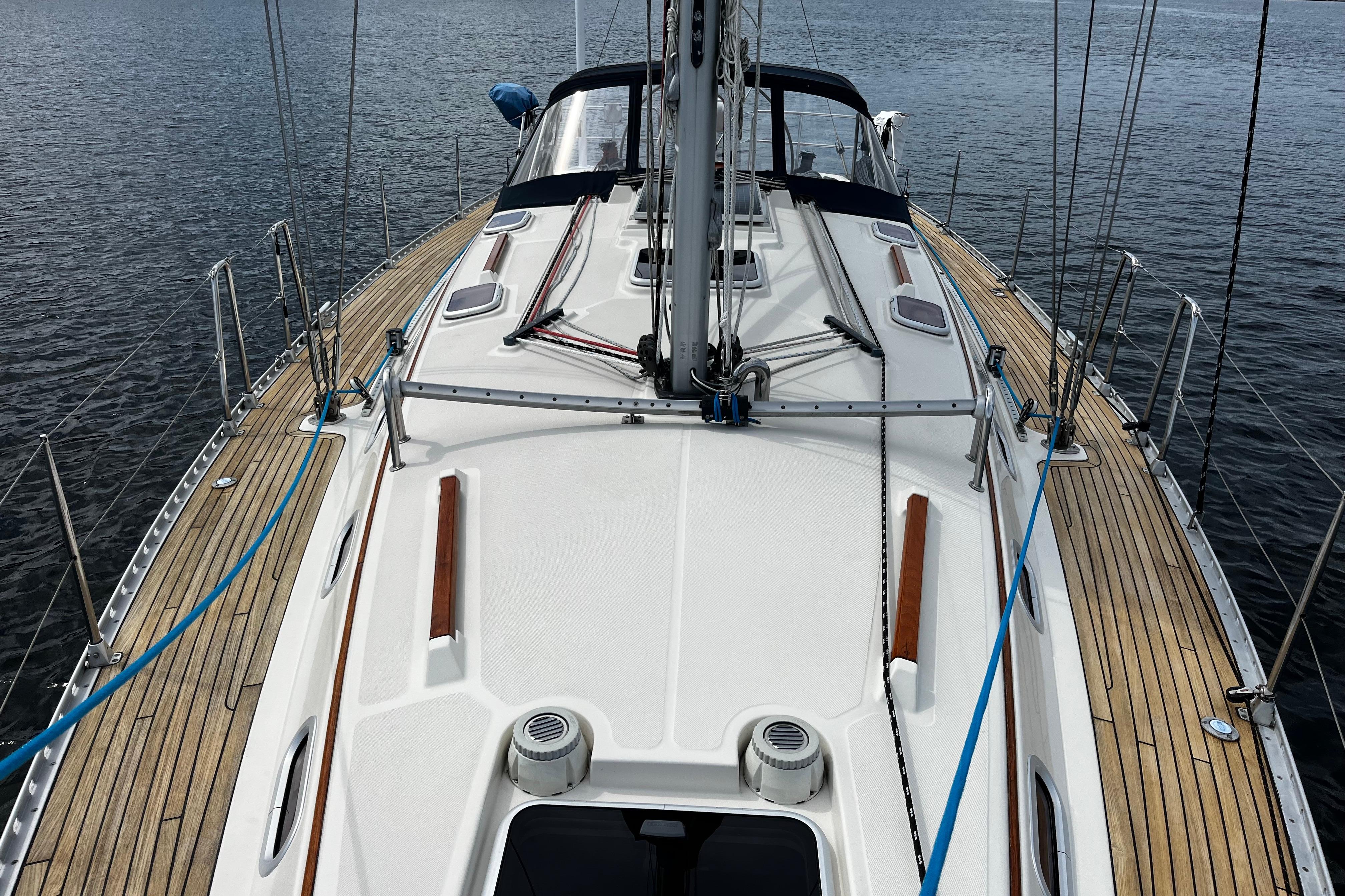2004 Hanse 411 sailboat deck with wooden accents on calm water.