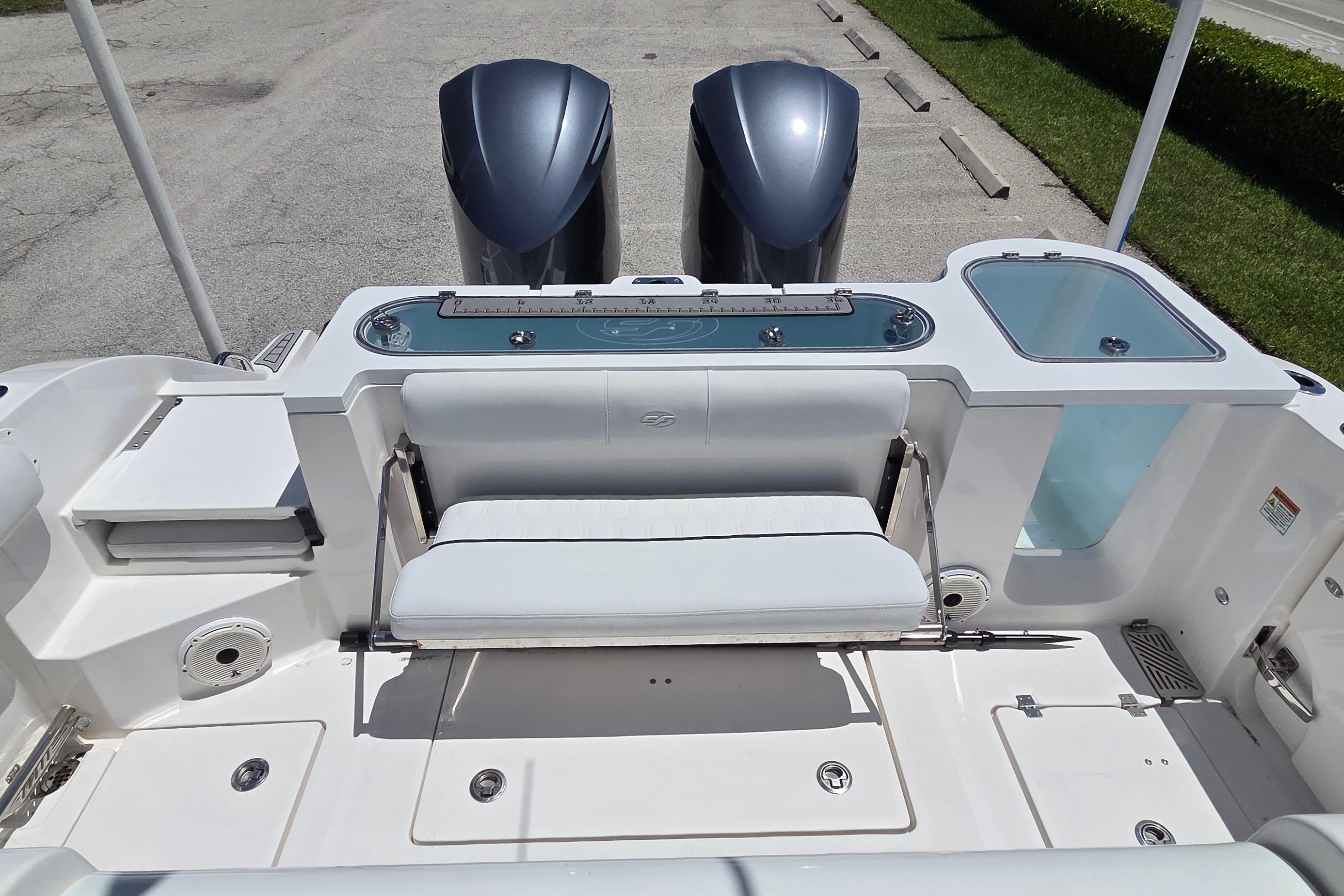 2021 Sea Fox 328 Commander boat with dual engines and spacious seating area.