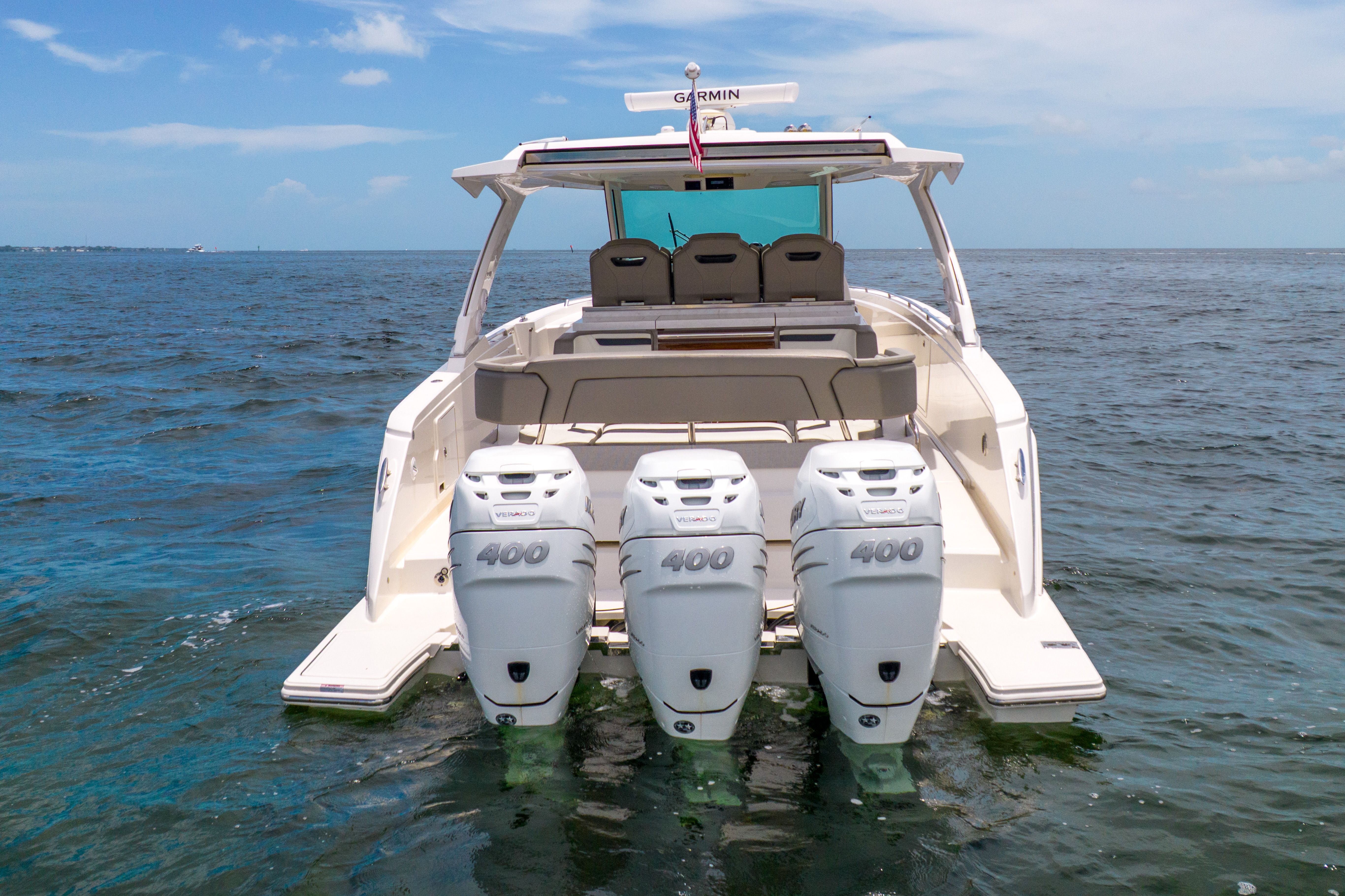 The 2023 Tiara Yachts 38 LS is a sleek boat with three powerful outboard engines.