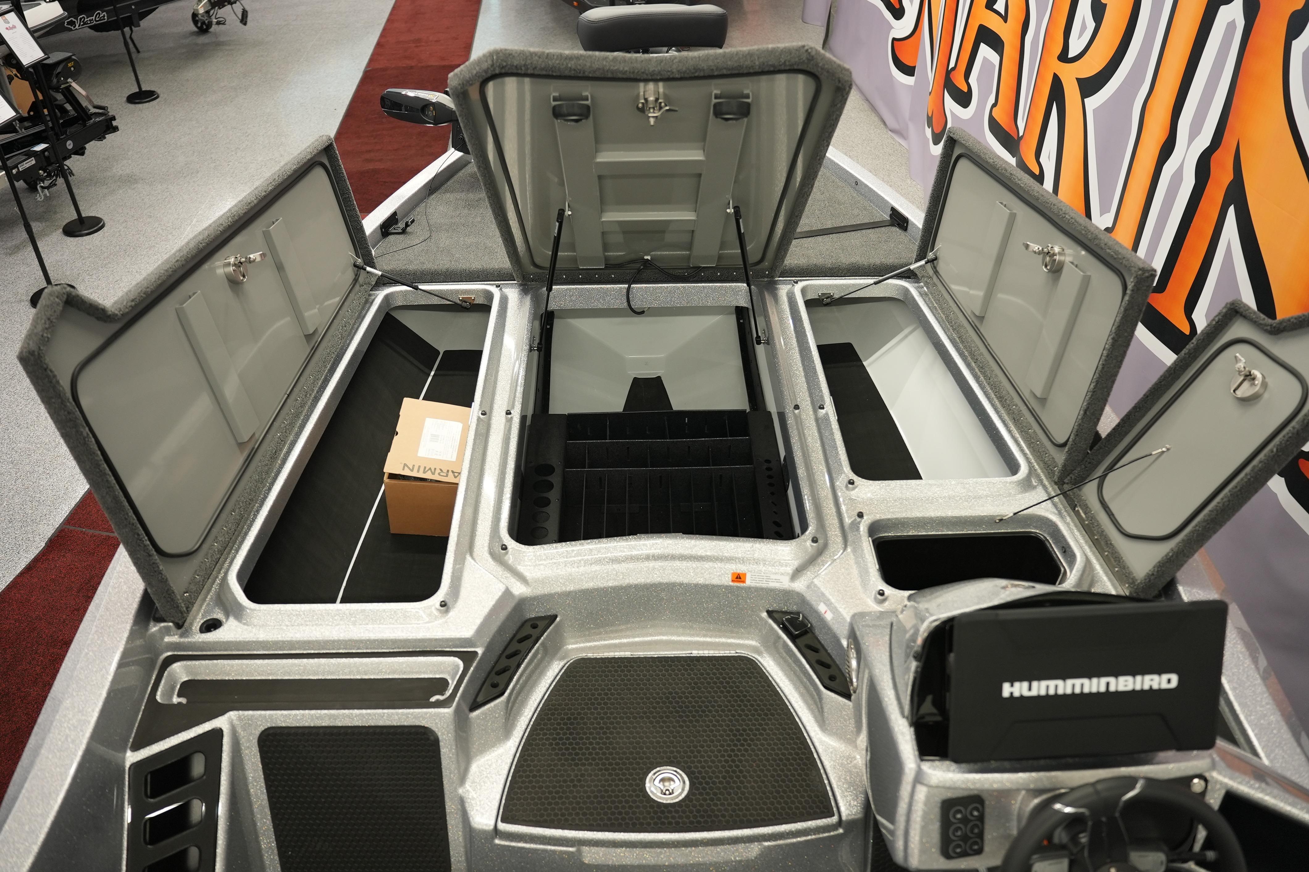 Open storage compartments on a 2026 iKon LXE20 boat, featuring Humminbird electronics.