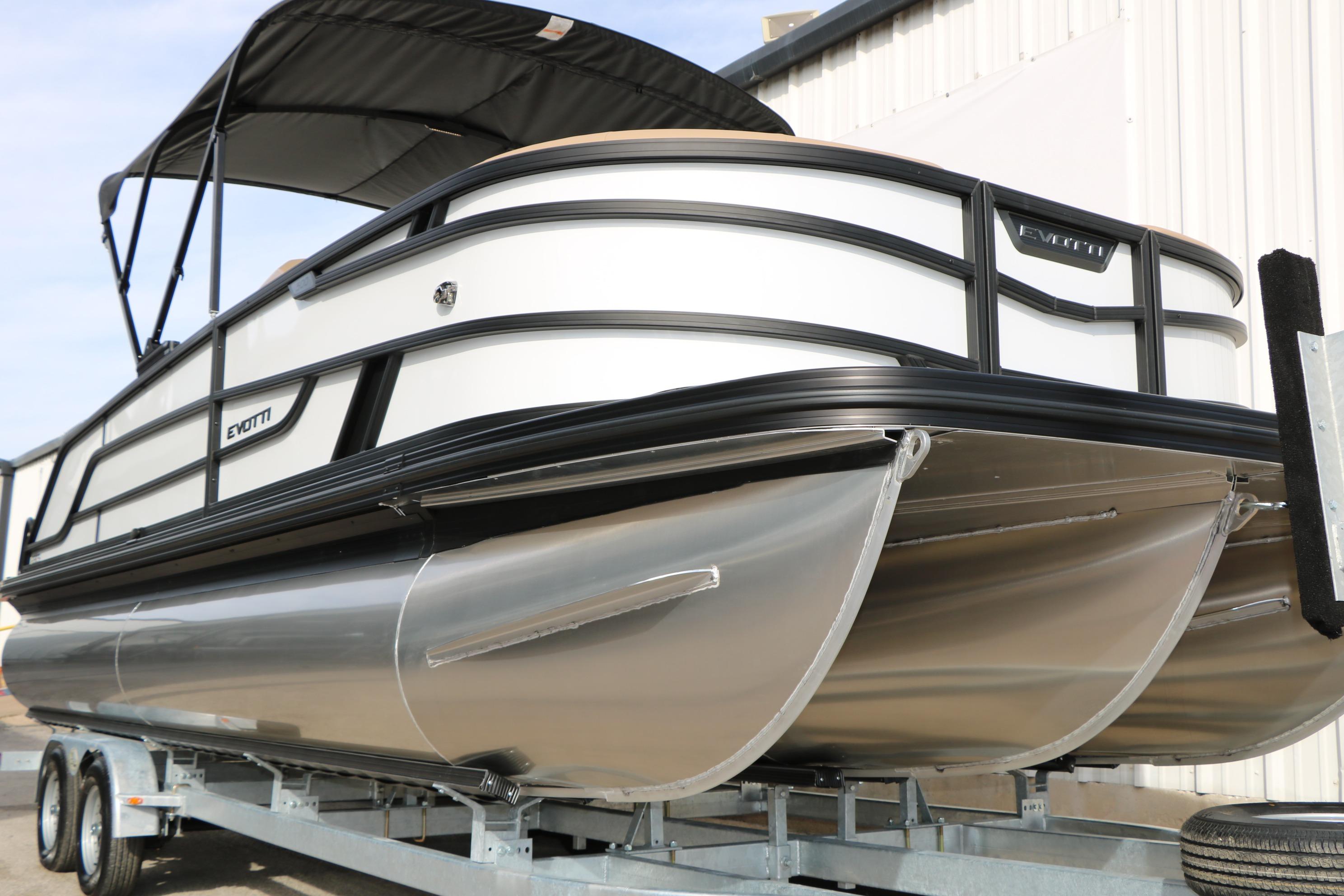2026 Evotti 523CS pontoon boat on trailer, featuring sleek design and modern aesthetics.