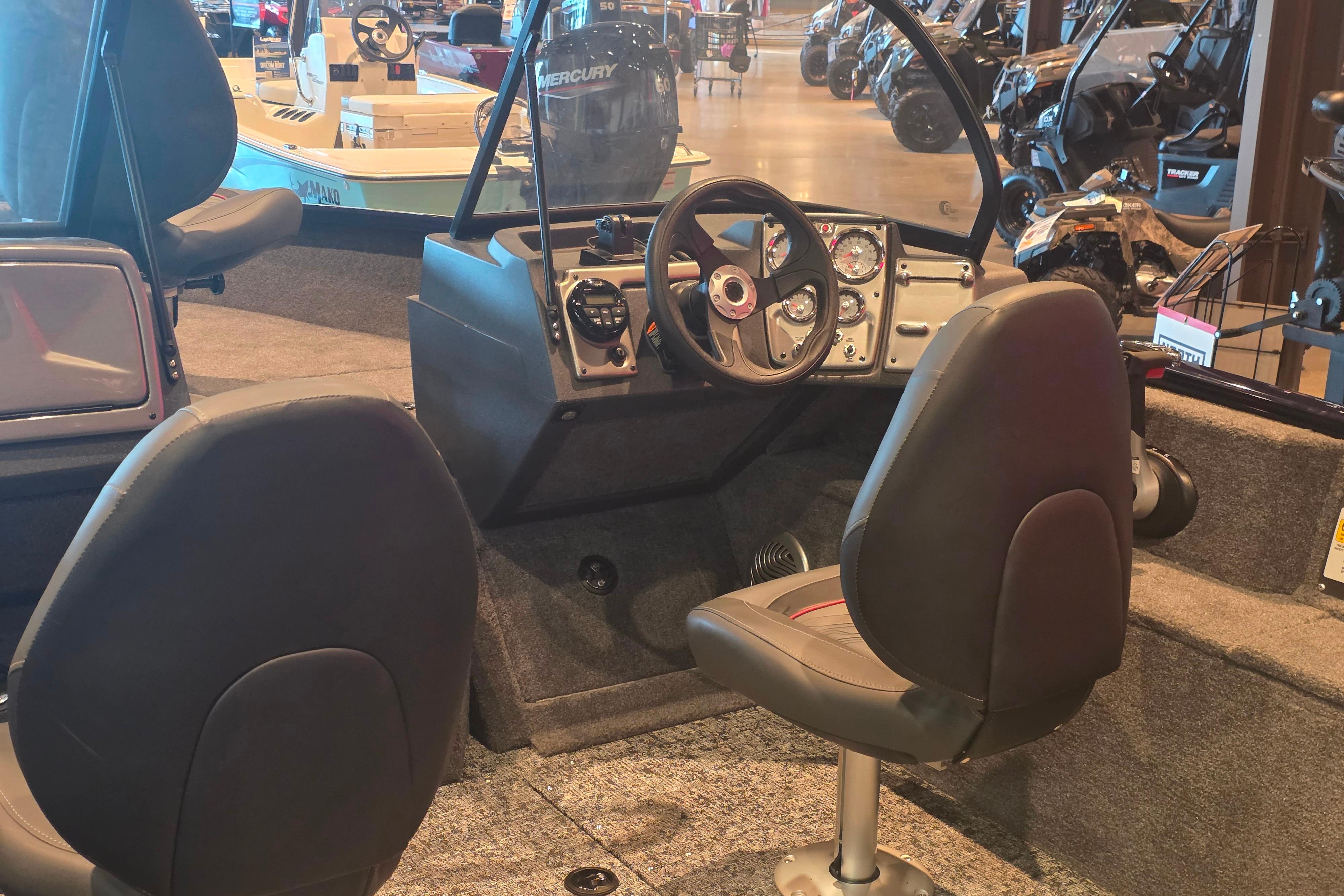 Interior of 2026 Tracker Pro Guide V-175 Combo boat with steering wheel and seats.