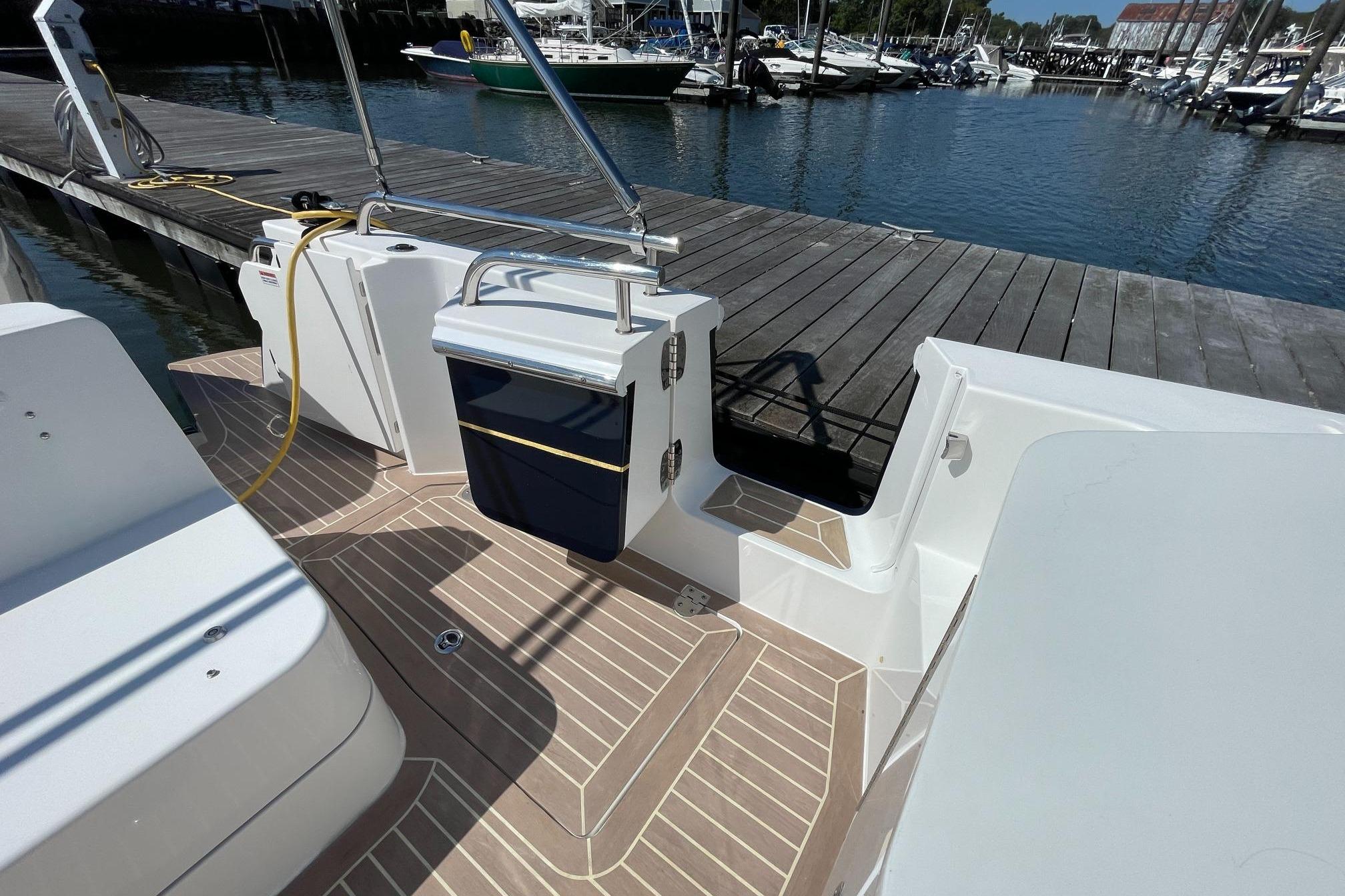 2023 MJM 35 boat docked, featuring a sleek deck and modern design.