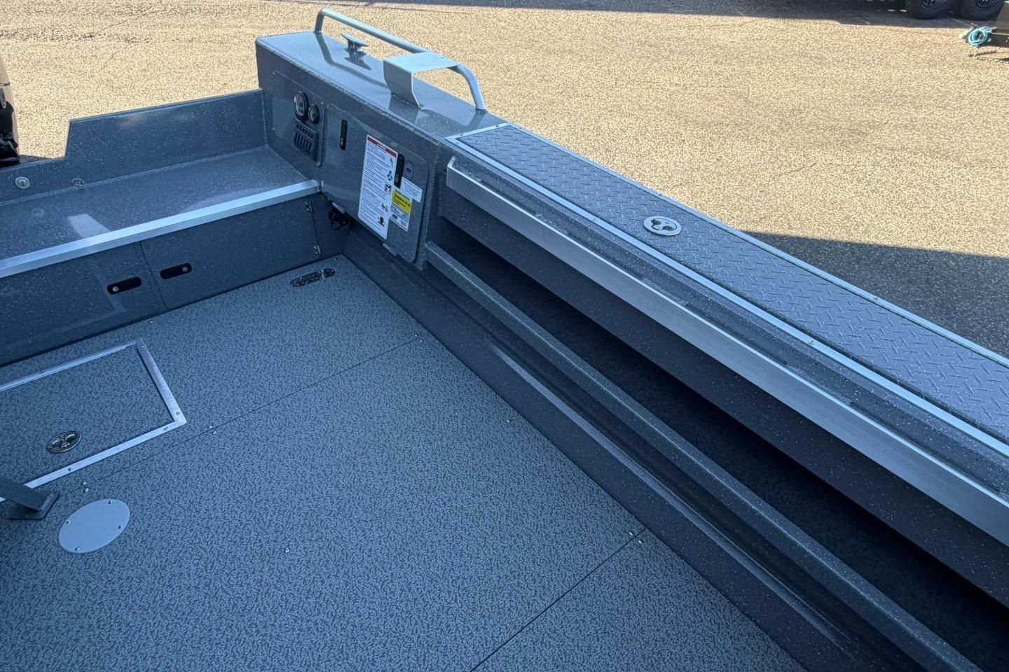Interior view of 2026 Thunder Jet 209 Rush OT boat, showcasing storage and seating area.