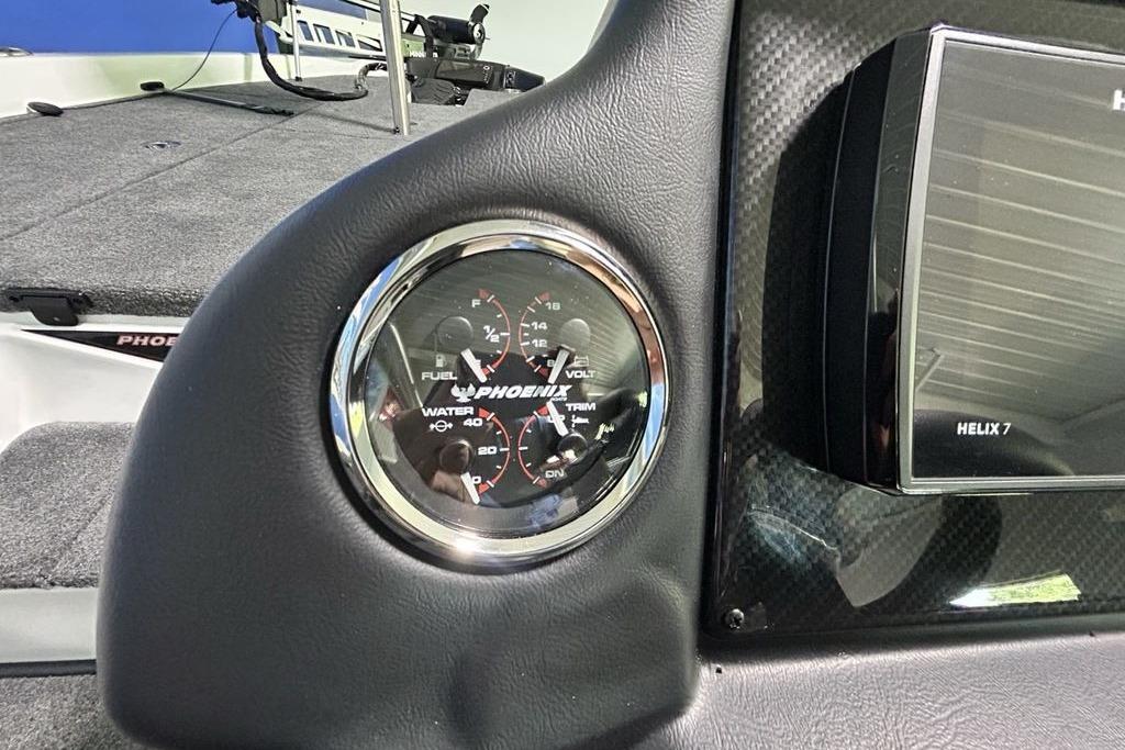 Dashboard of 2026 Phoenix 818 Pro boat with gauges and Helix 7 display.