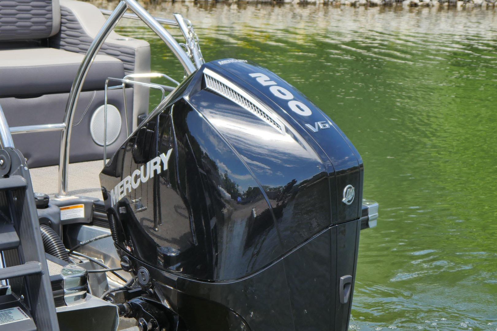 2023 Barletta CORSA 25UE with Mercury 200 V6 engine on a serene lake.