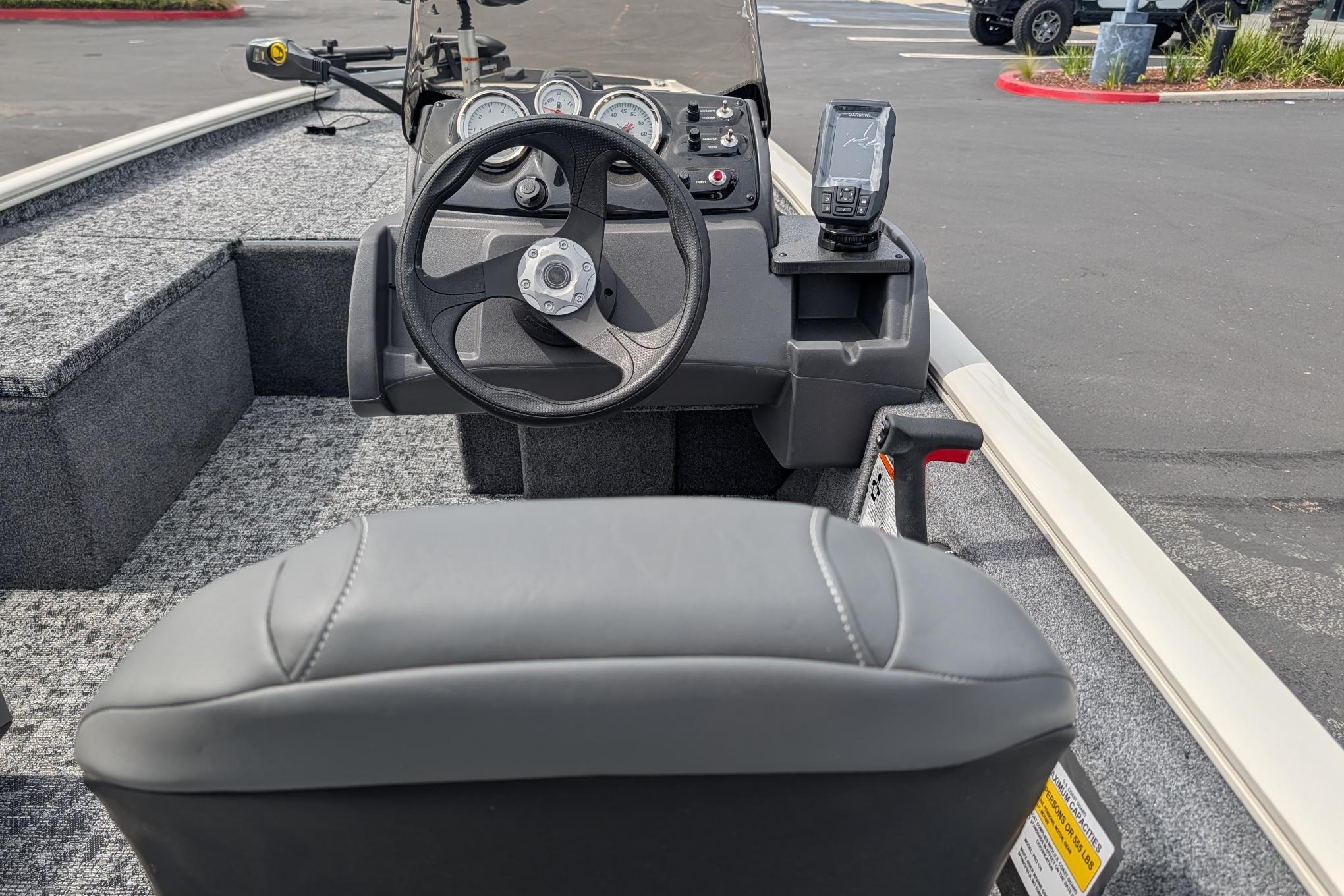 Interior view of 2026 Tracker Pro 170 boat cockpit with steering wheel and controls.