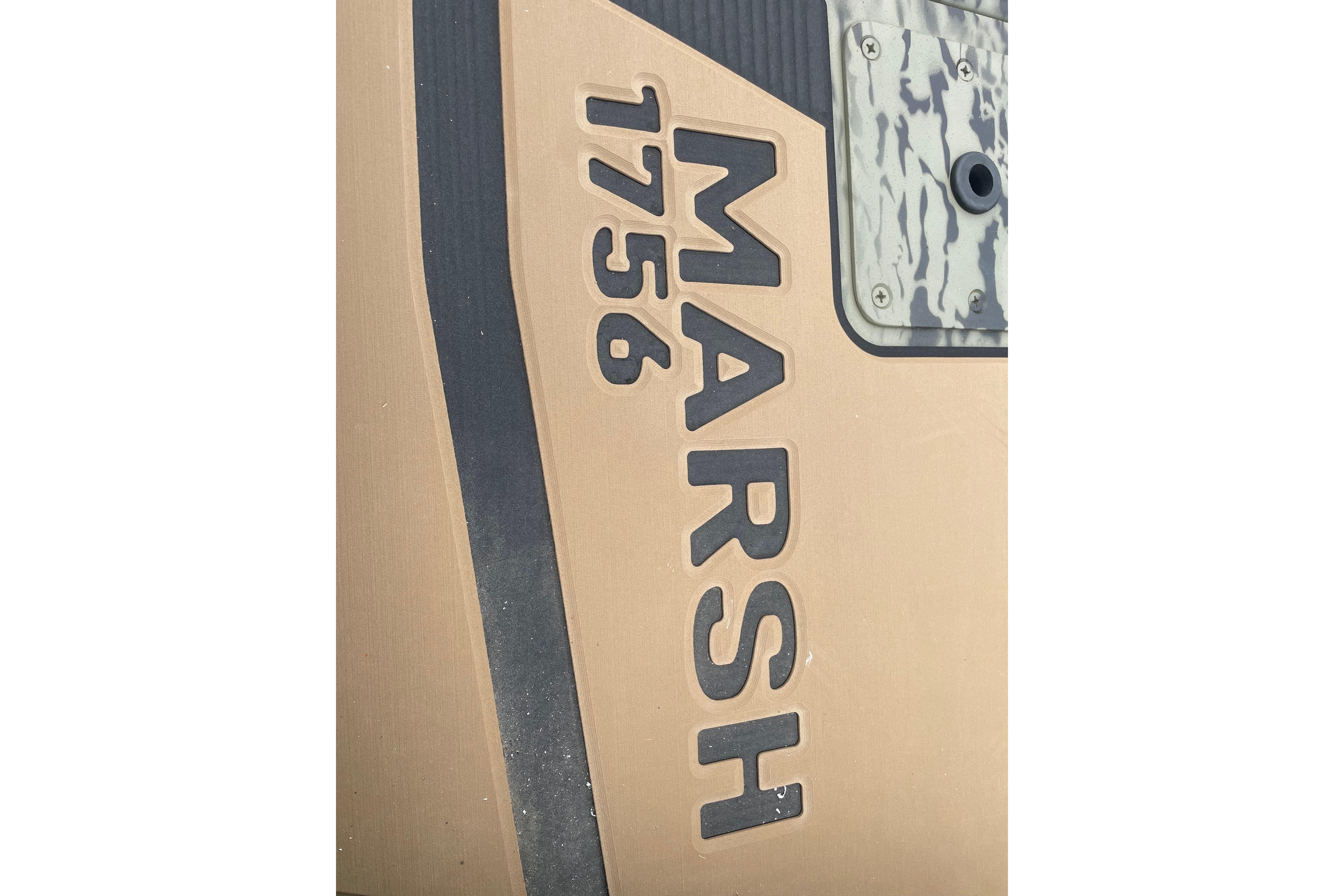 Close-up of 2026 Tracker Grizzly 1756 T Marsh boat lettering.