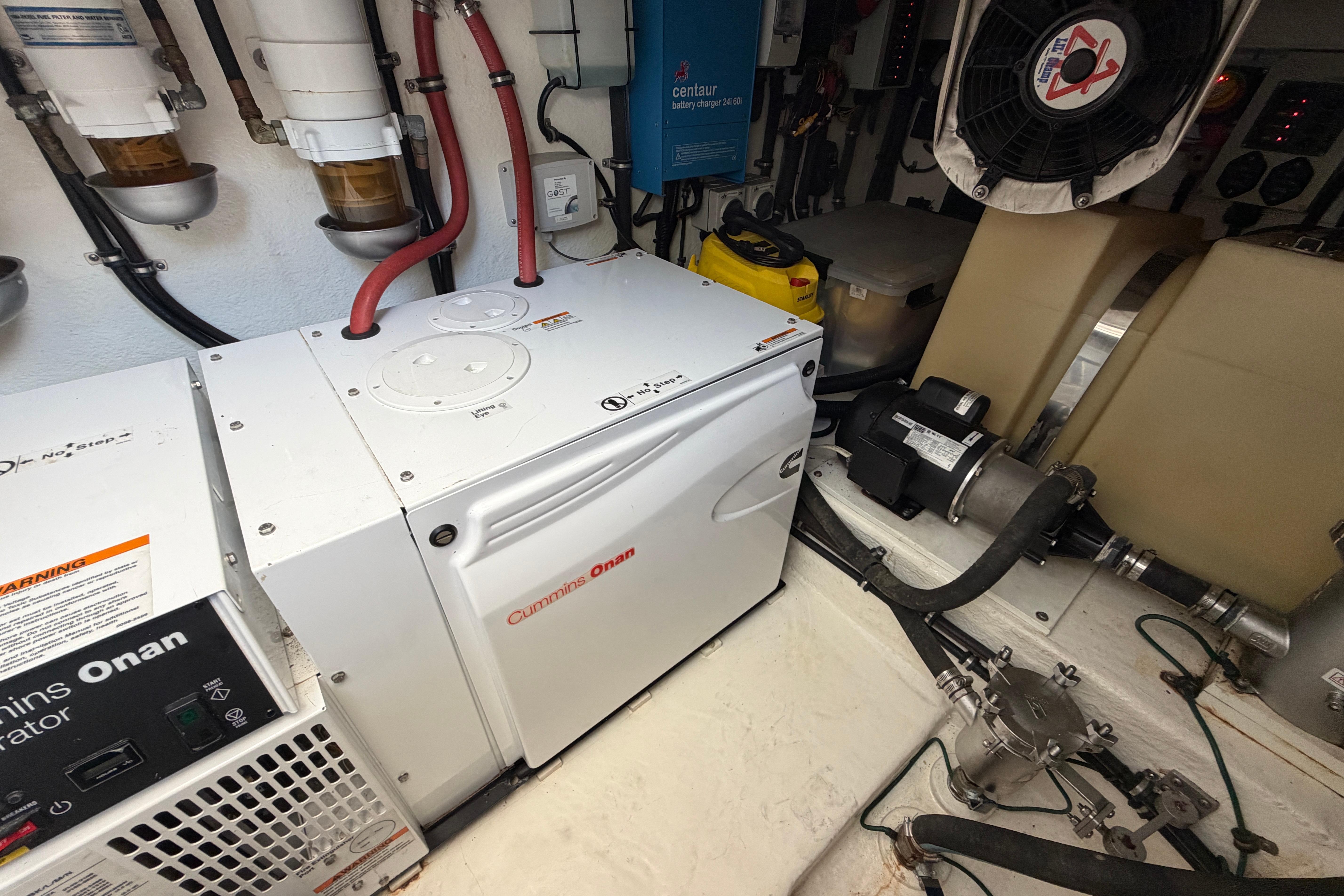 Forward engine room of 2015 Riviera 445 SUV with Cummins Onan generator and equipment