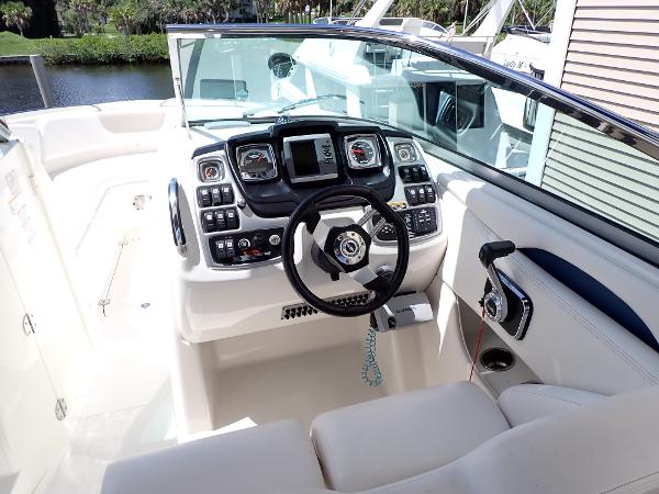 2011 Chaparral 287 SSX boat cockpit with modern controls and steering wheel.