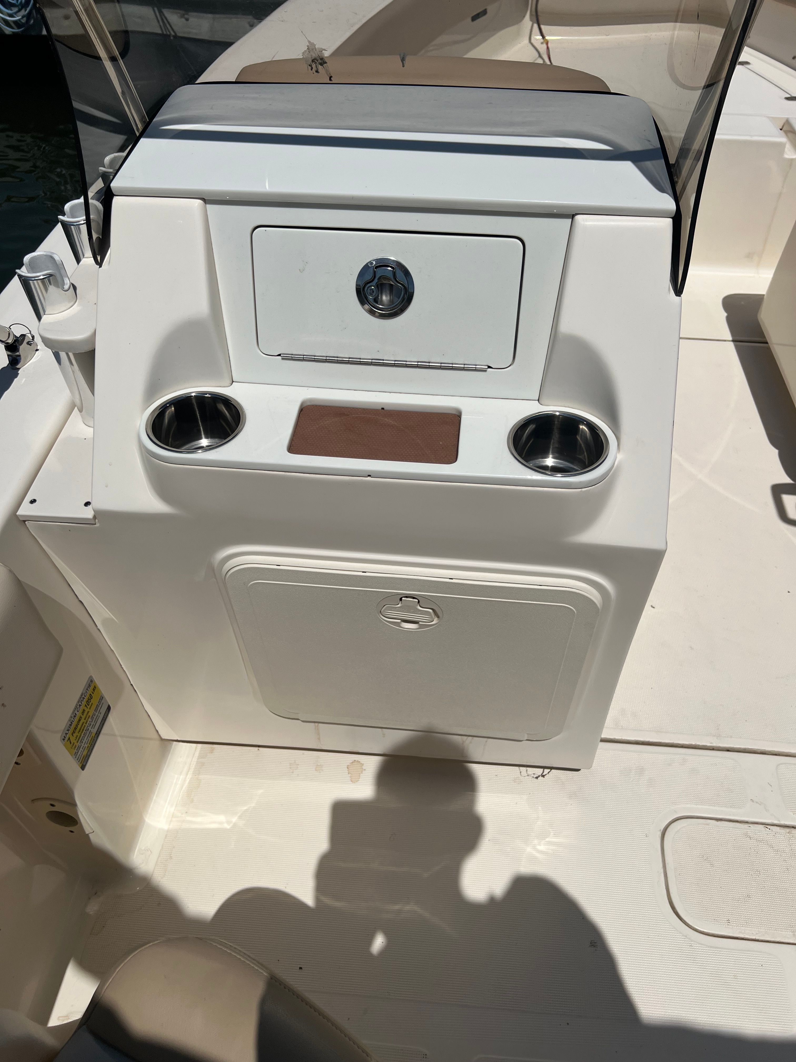 The image shows the cockpit of a 2021 Scout 195 Sport Dorado boat with cup holders.