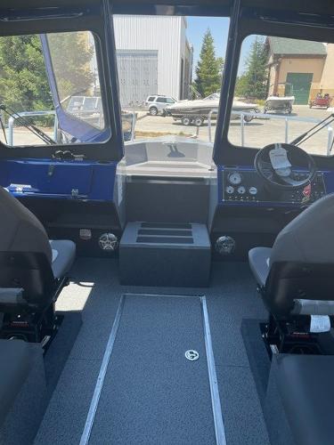 2025 Spartan 240 Maximus Pro boat interior with dual seats and control panel.
