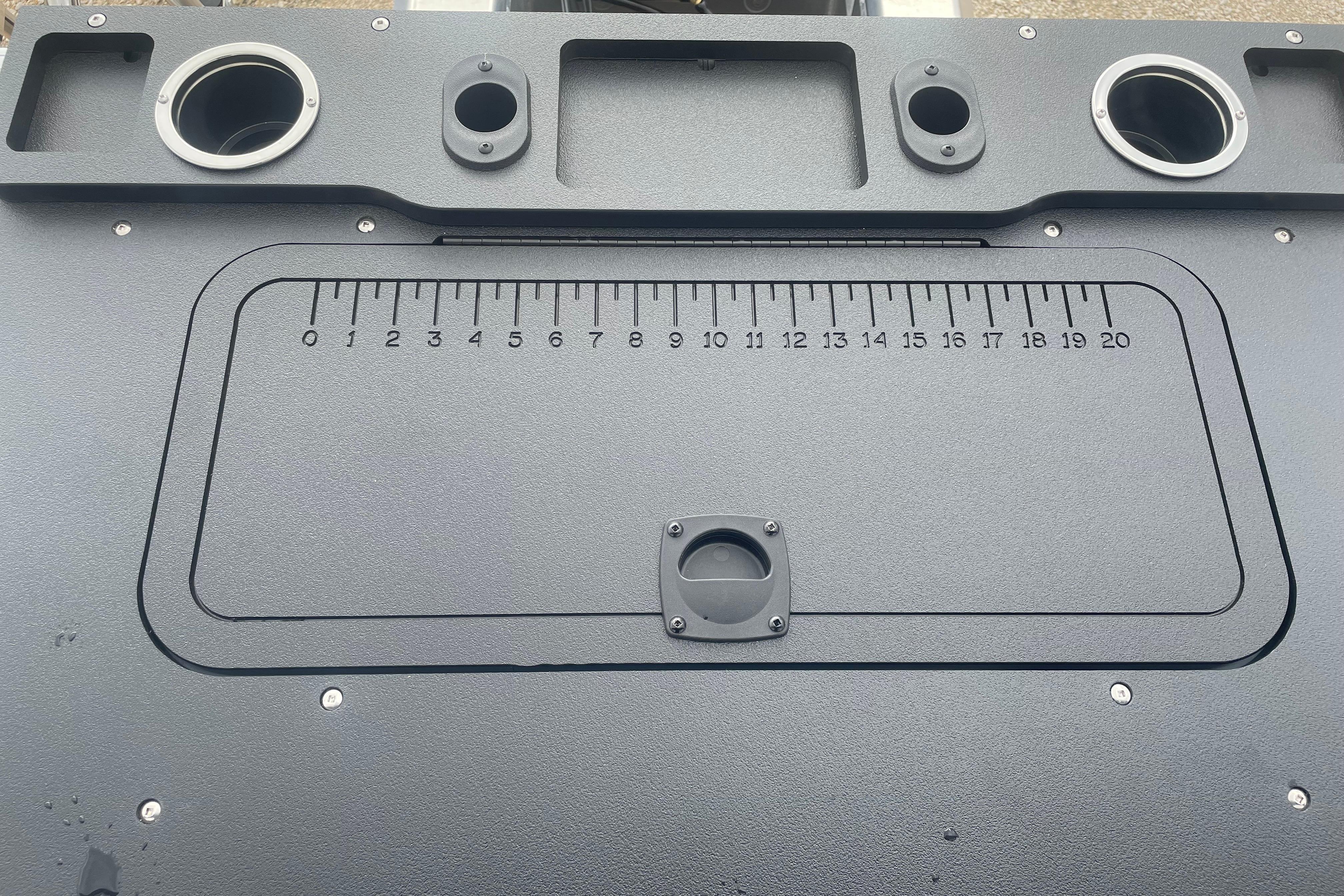 Dashboard of 2026 Sun Tracker Fishin' Barge 22 XP3 with integrated measuring ruler.