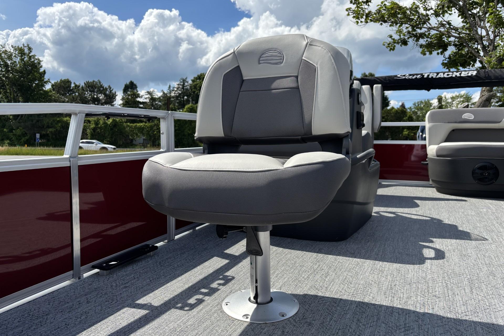 2026 Sun Tracker Bass Buggy 16 XL Select boat seat under a cloudy sky.