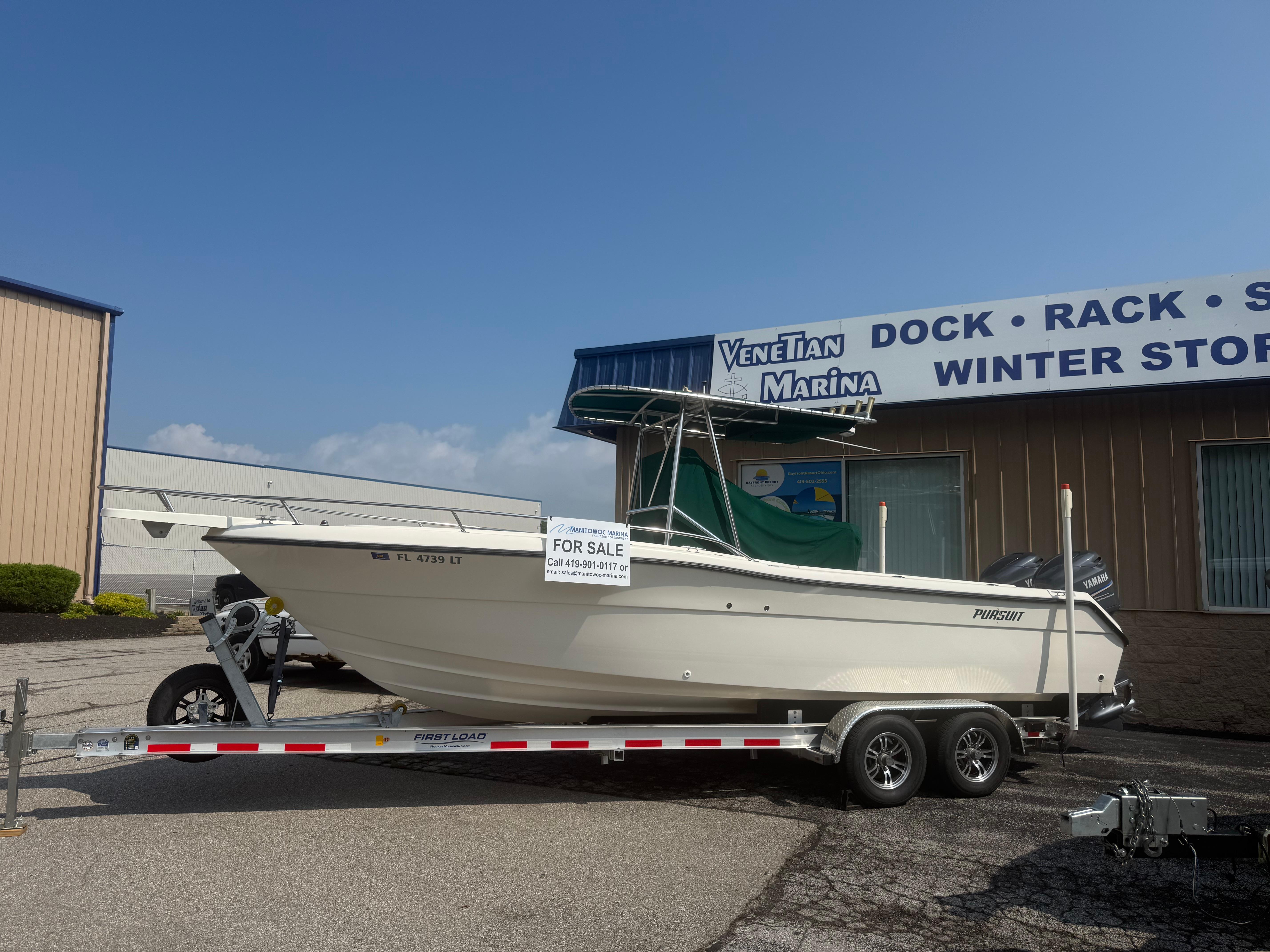 2002 Pursuit 2470 CC boat for sale on trailer at Venetian Marina.