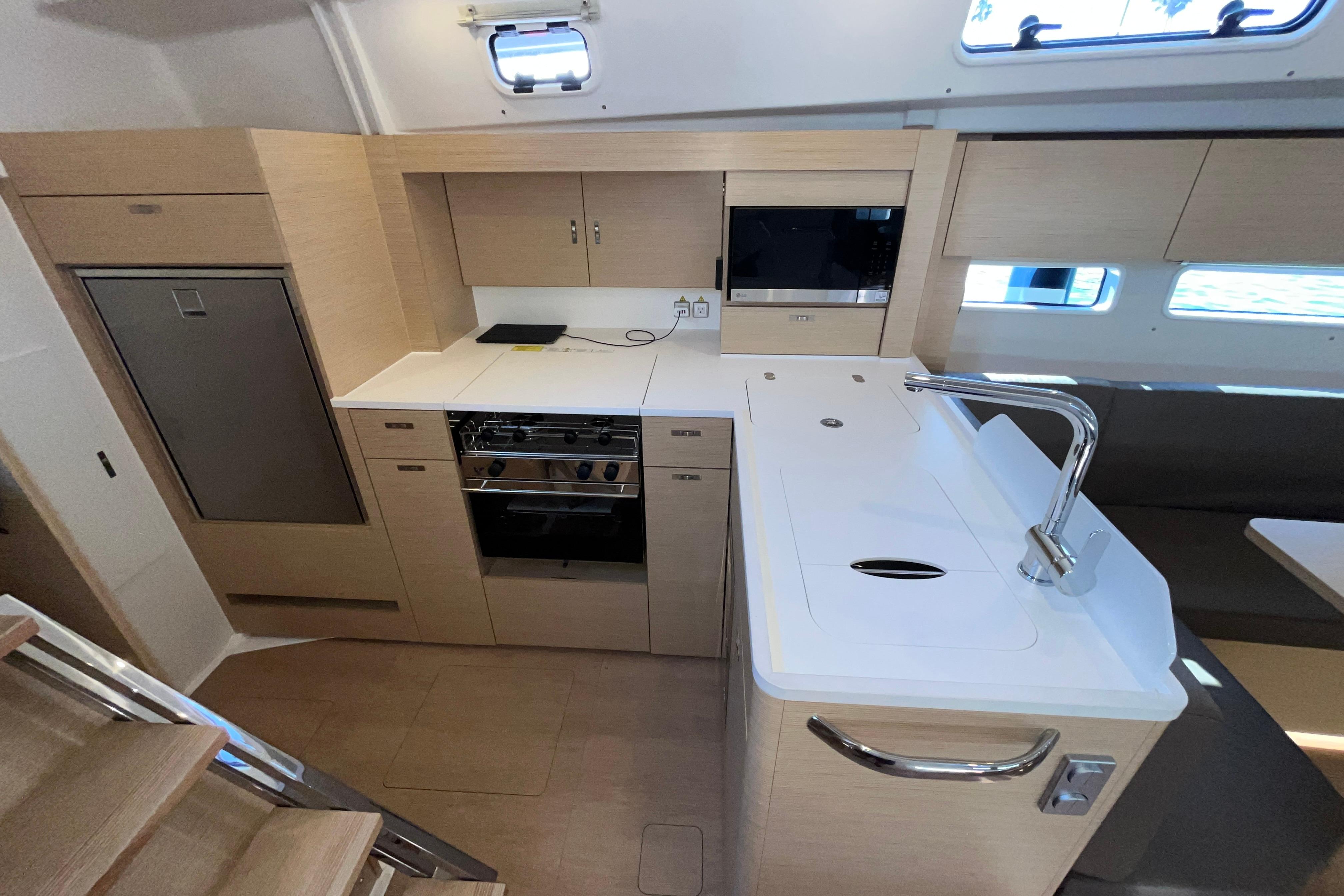 Modern kitchen interior of 2025 Hanse 360 yacht with sleek cabinetry and appliances.