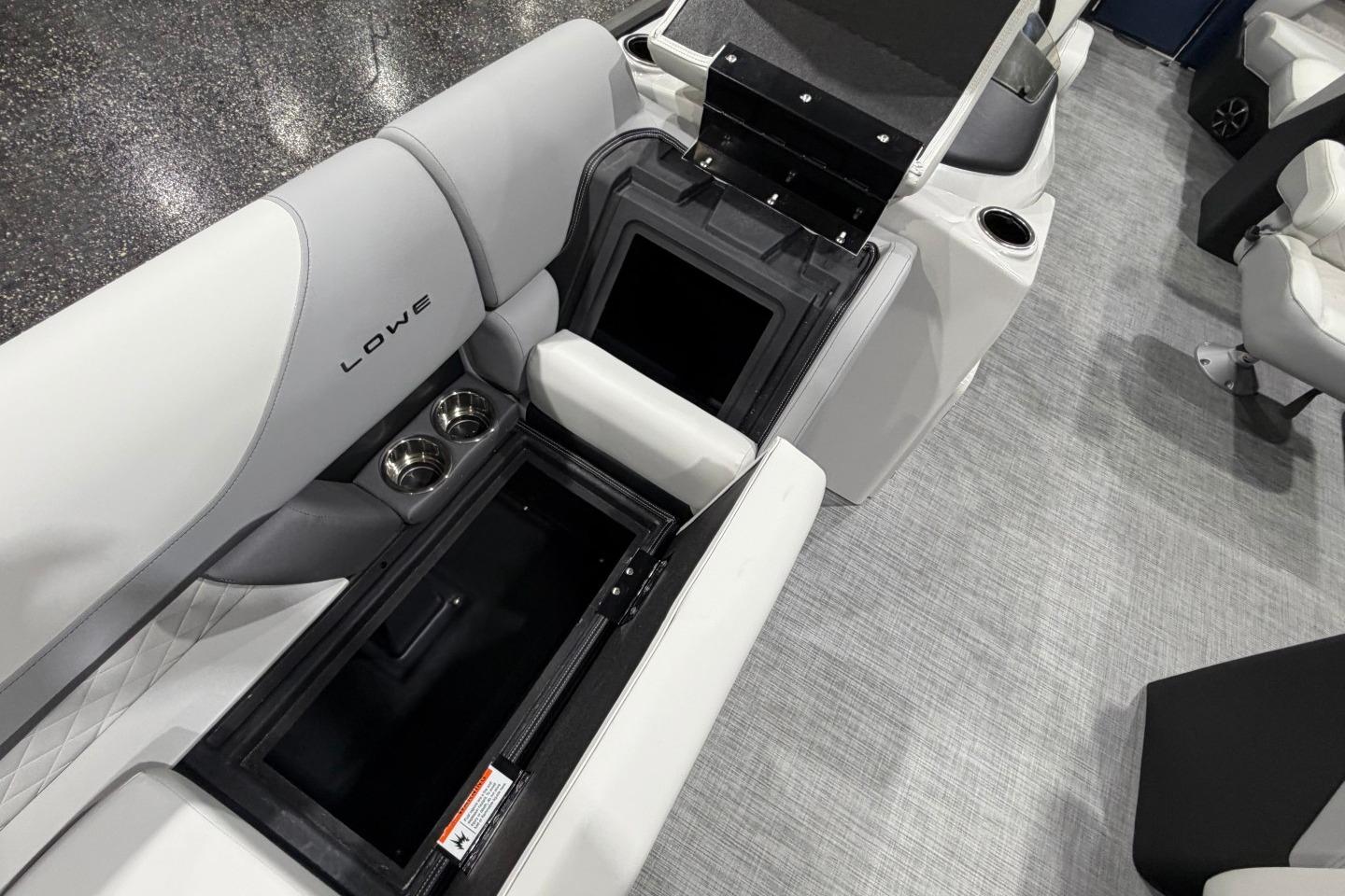Interior of 2026 Lowe SS 230 WT boat with open storage and cup holders.