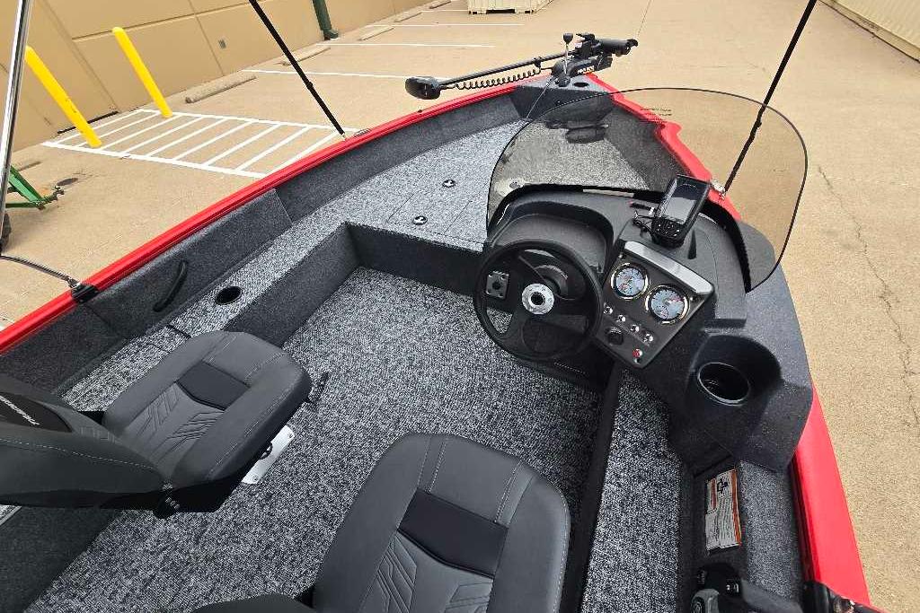 2026 Tracker Pro Guide V-16 SC boat interior with steering console and seating.