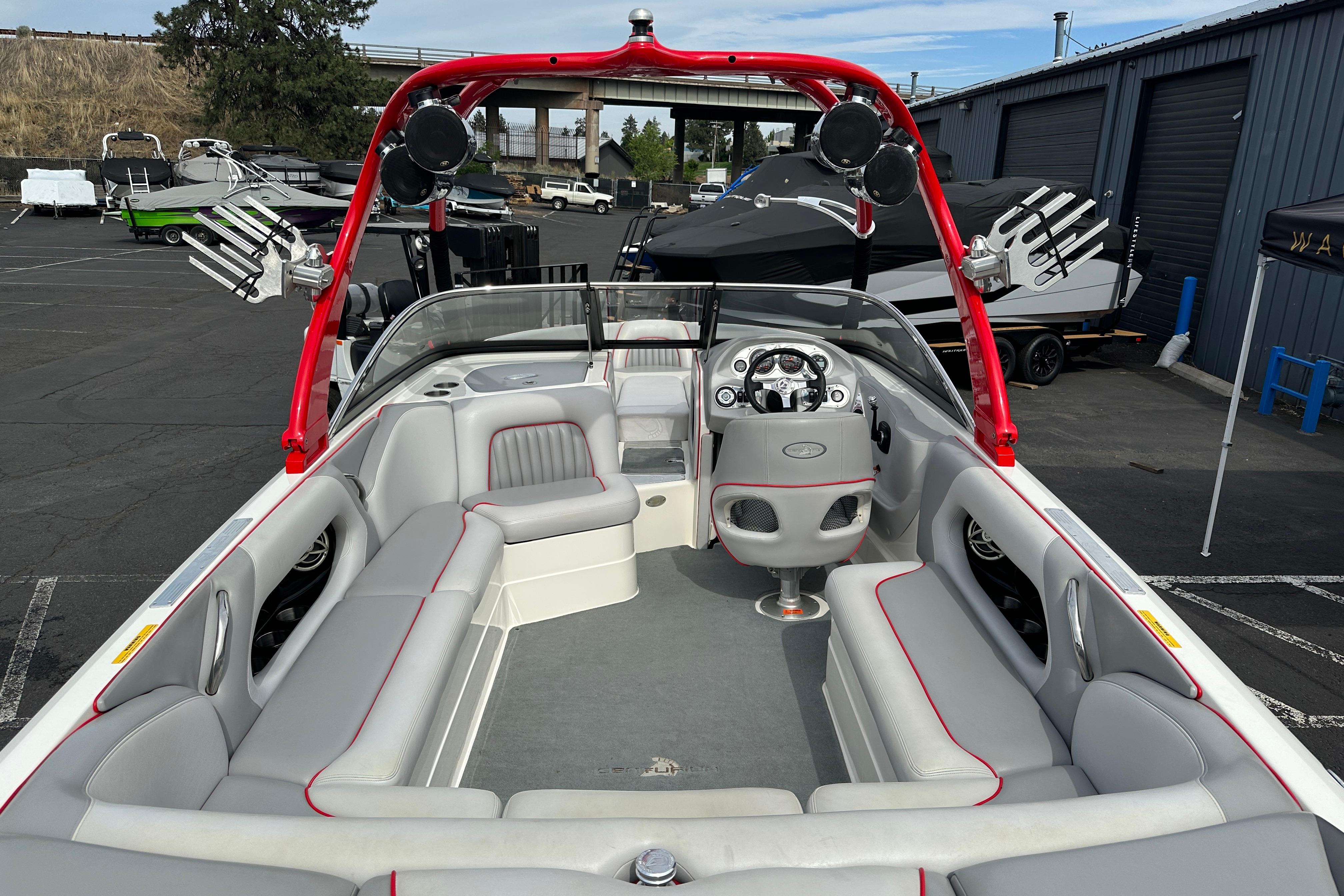 2008 Centurion Enzo SV240 boat interior with red accents and spacious seating.