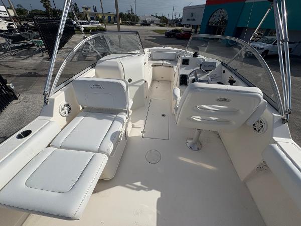 2020 Cobia 220 Dual Console boat with white seating and spacious deck layout.