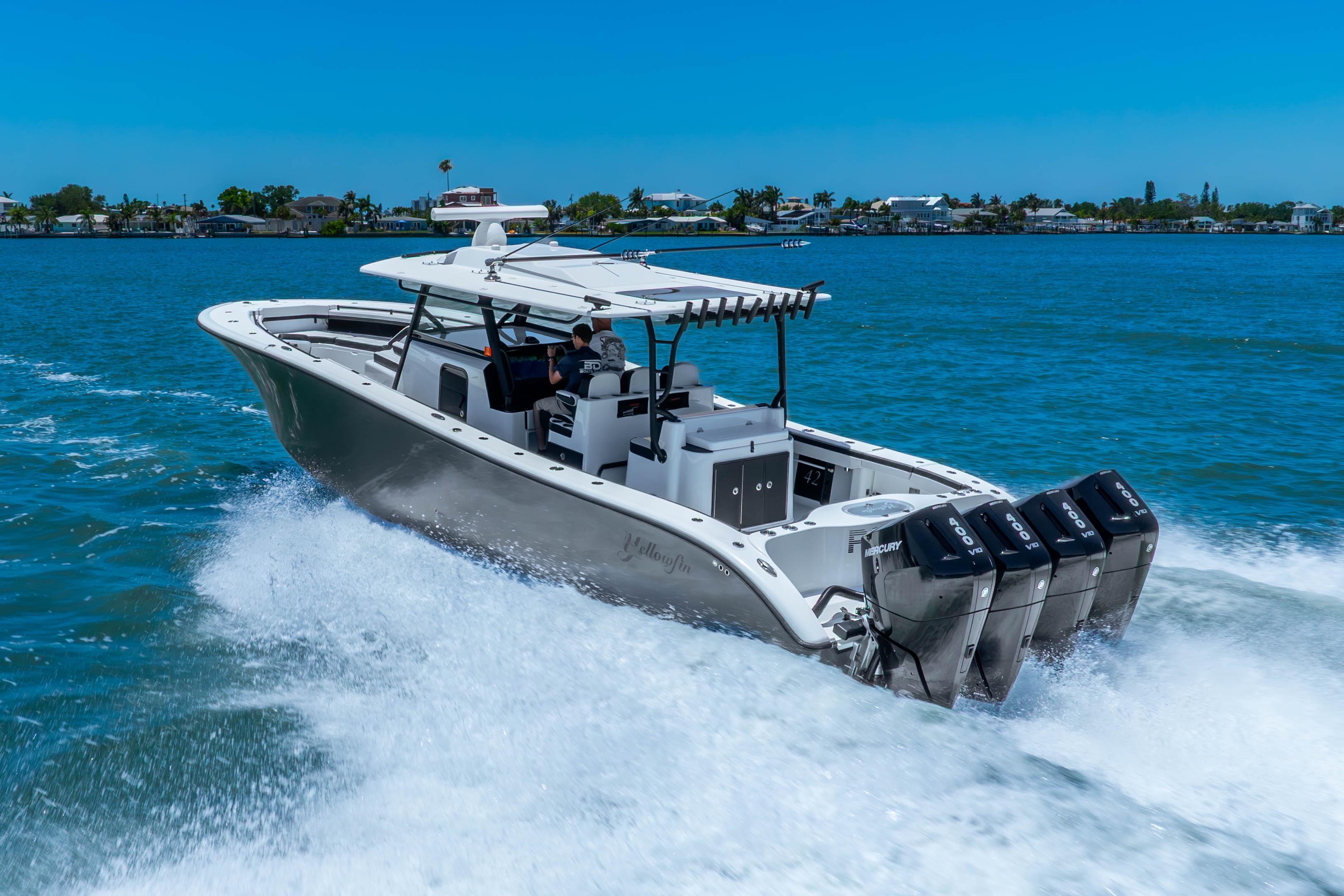 2024 Yellowfin 42 Offshore boat cruising on blue water with powerful engines.