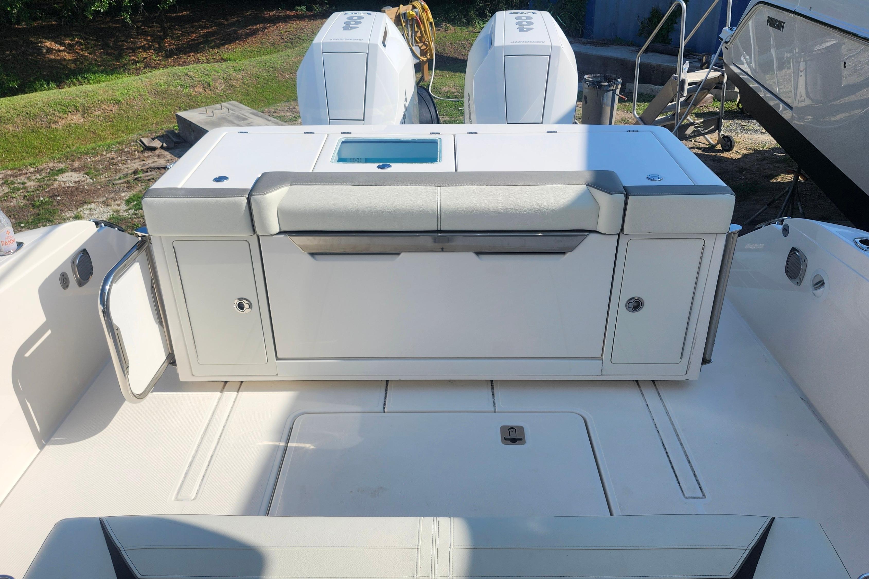 2024 Tiara Yachts 34 LS boat deck with seating and storage compartments.