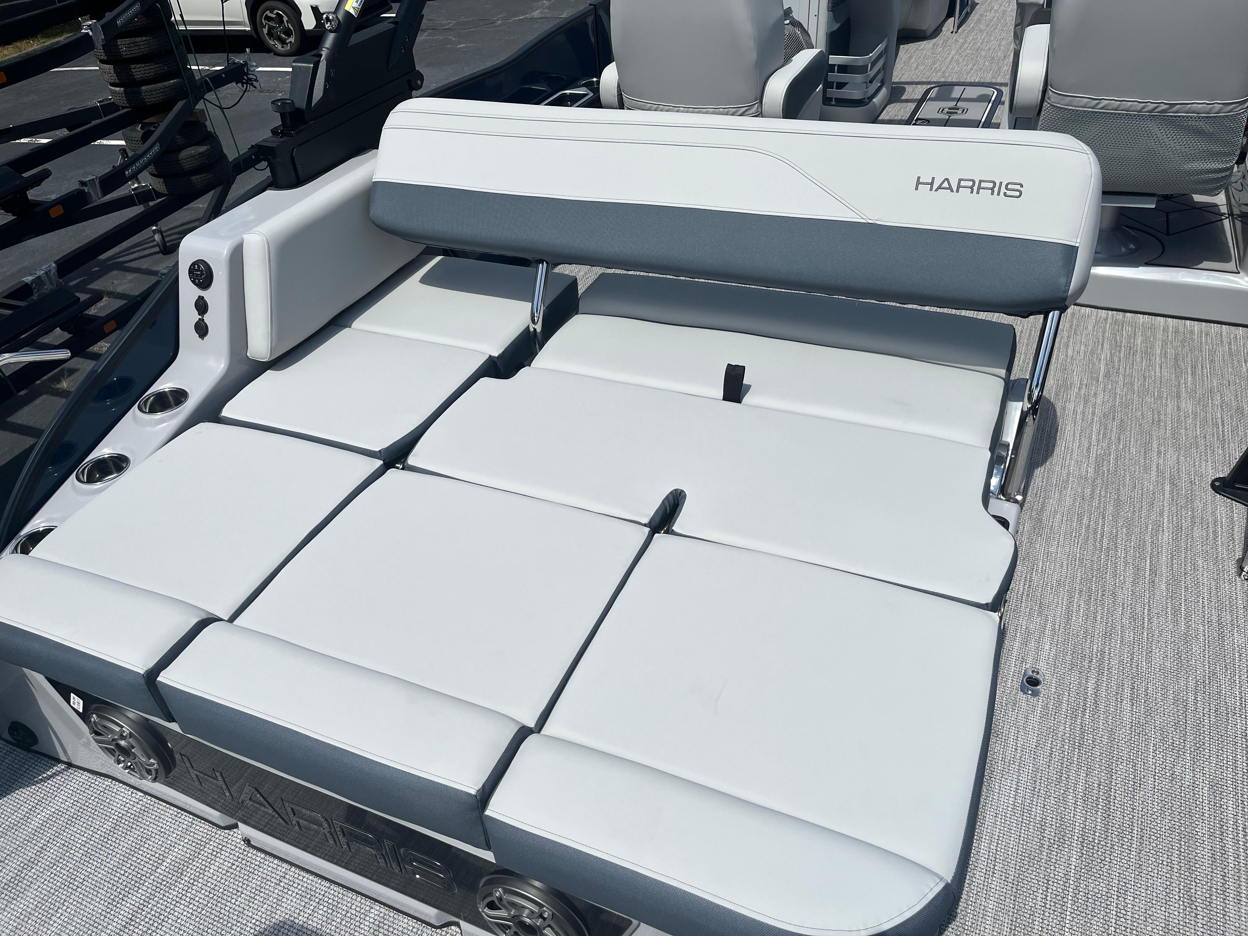 2026 Harris Grand Mariner 230 boat interior with luxurious seating and cup holders.