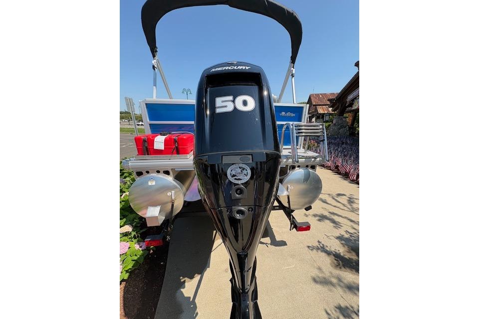 2026 Sun Tracker Party Barge 16 DLX with Mercury 50 outboard motor, docked outdoors.