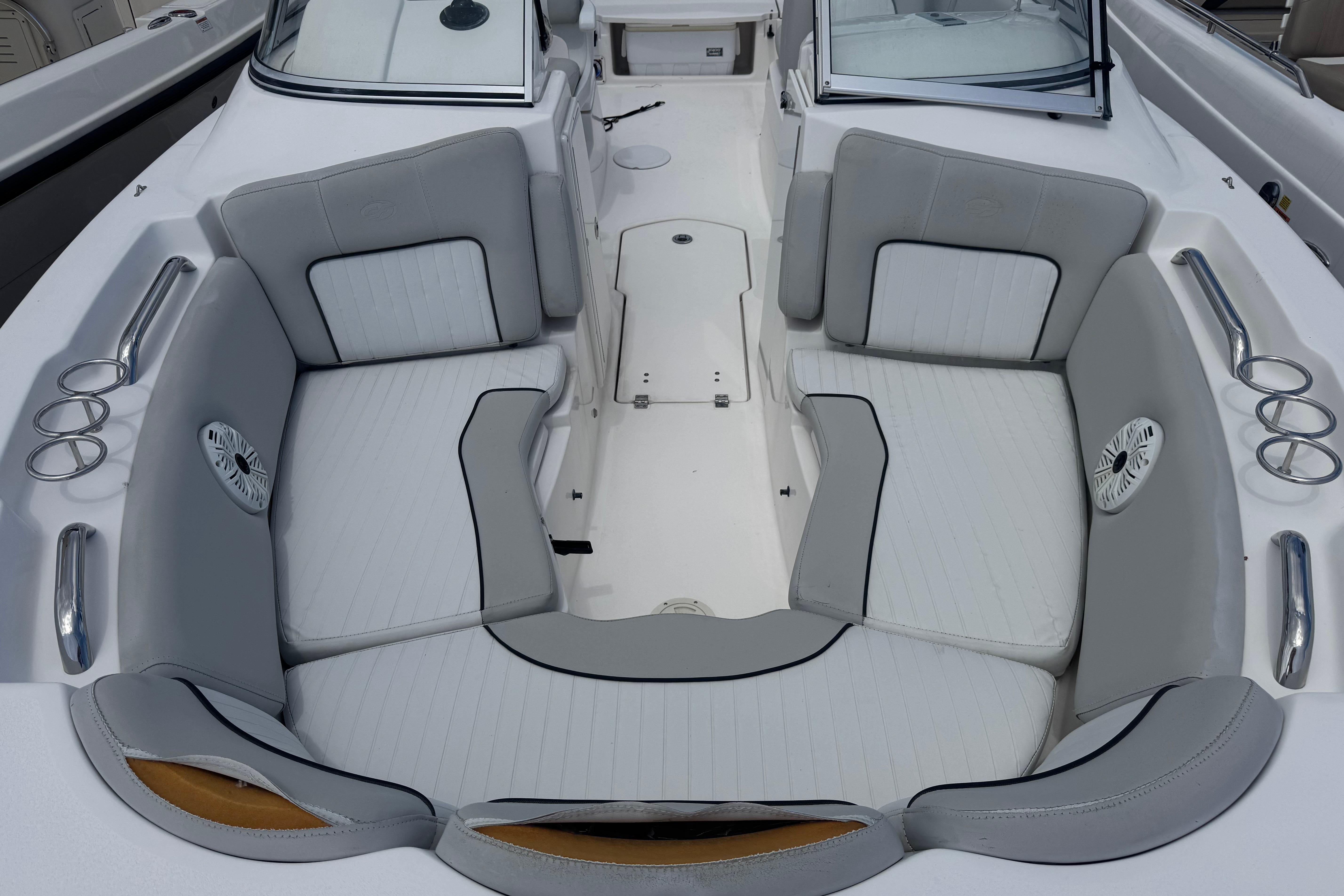 2020 Sea Fox 226 Traveler boat interior with cushioned seating and cup holders.