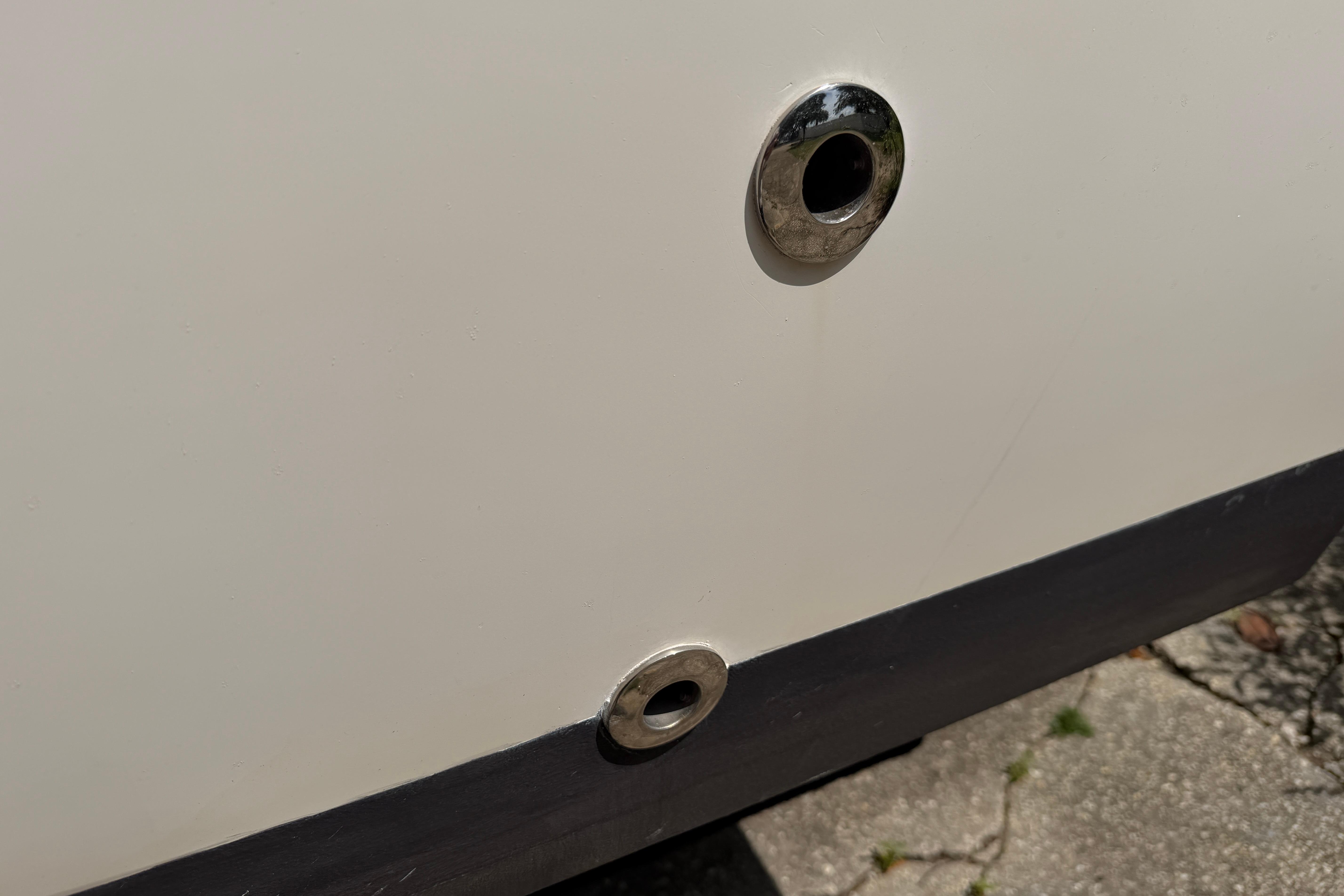 Close-up of 1987 Grady-White Seafarer 226 boat hull with metal fittings.