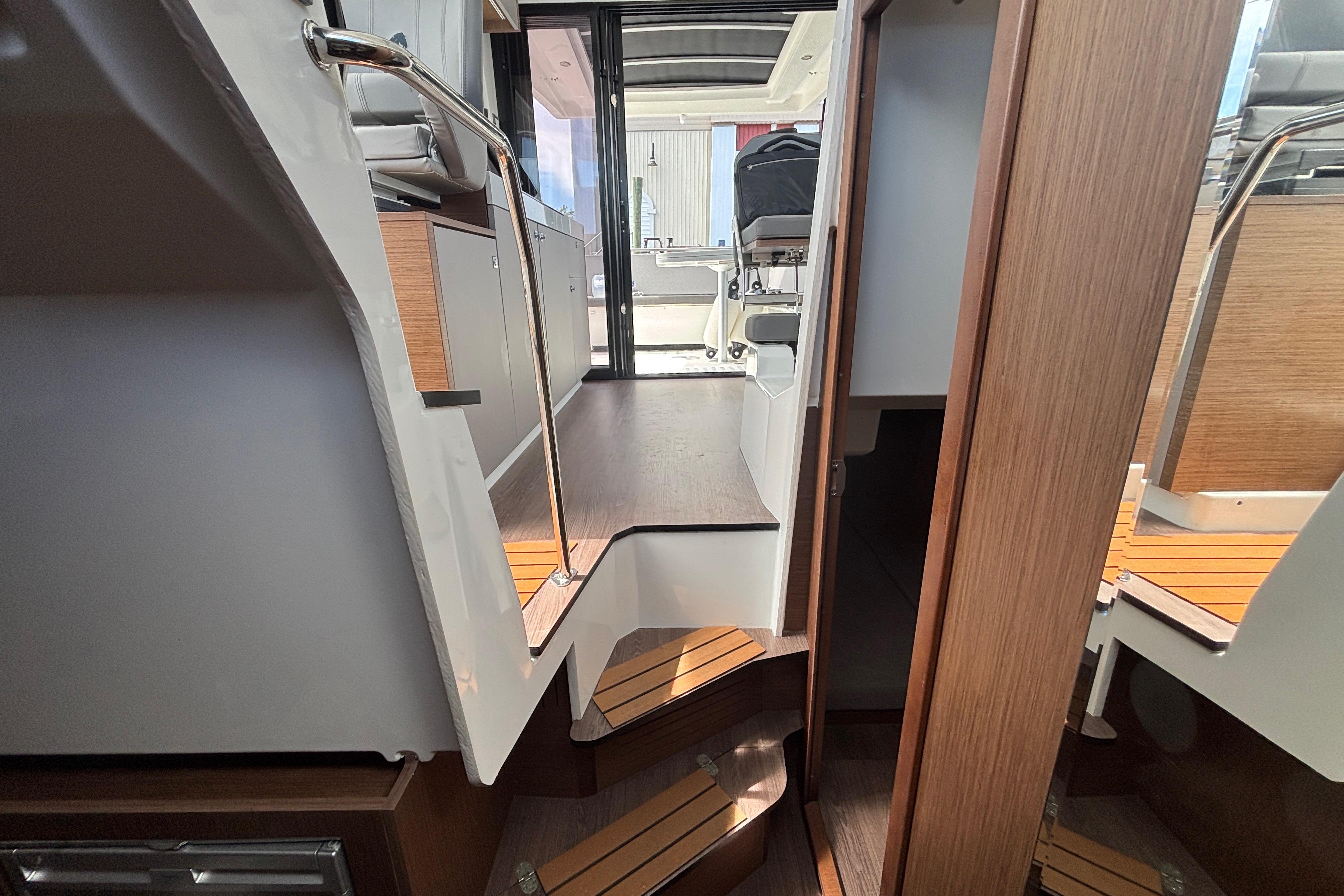 Interior view of 2024 Beneteau Antares 11, showcasing modern design and wooden finishes.