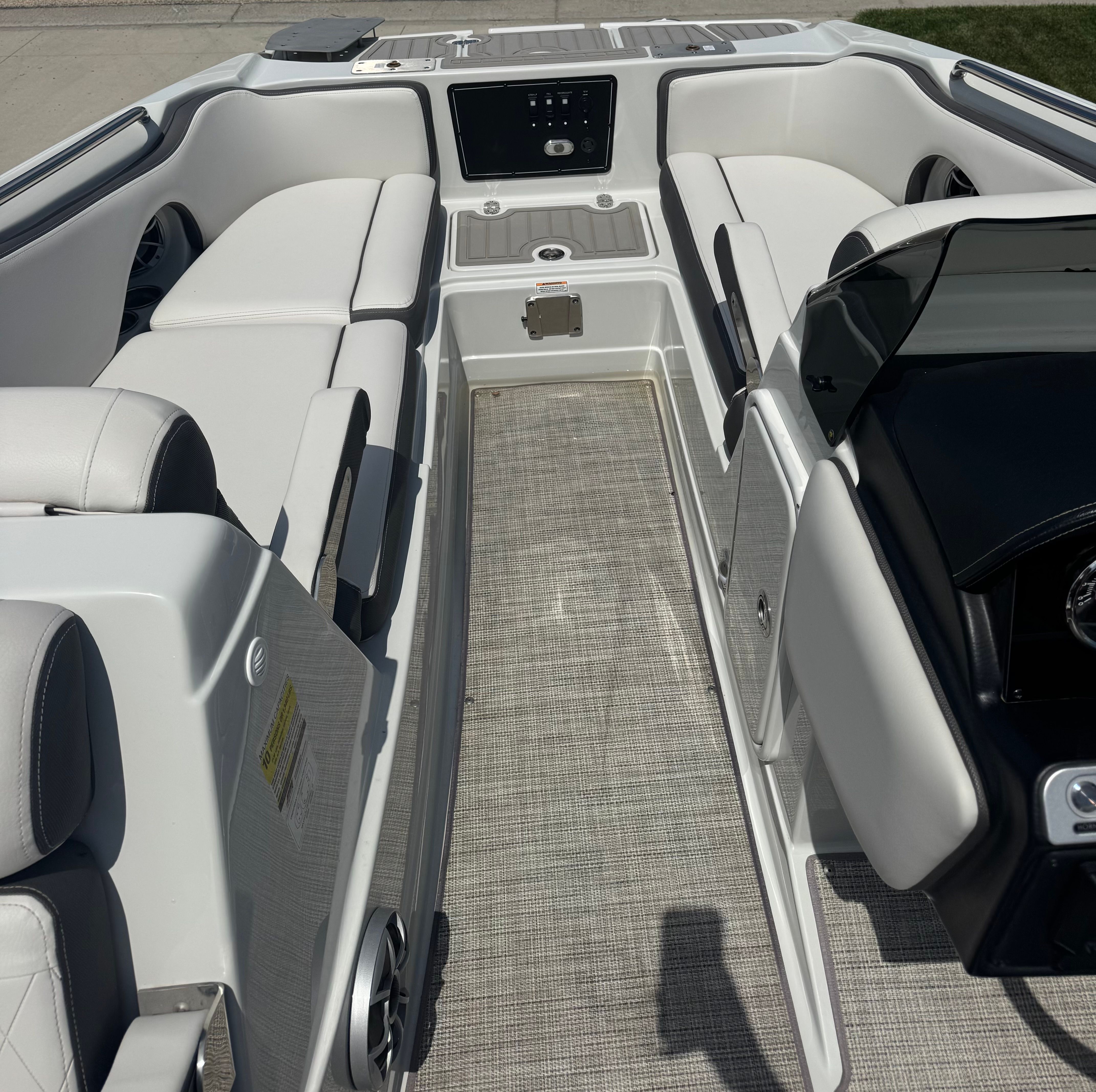 Interior of 2024 Crownline Eclipse E210 XS with white seating.