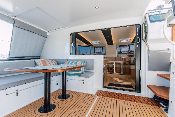 Modern Vision 444 yacht interior, 2026 model, featuring sleek design and comfortable seating area.