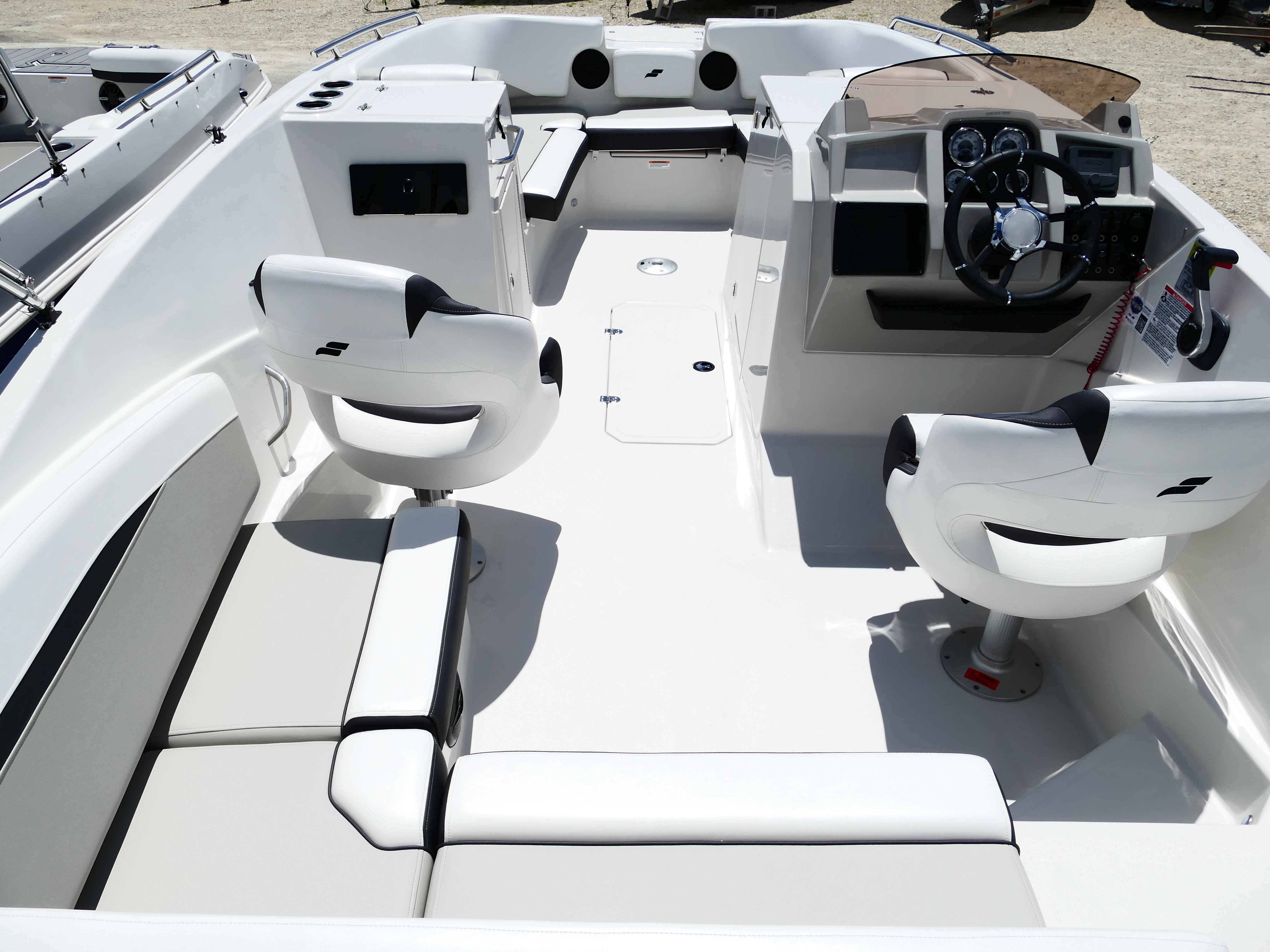 2026 Starcraft SVX 231 OB DH boat interior with modern seating and steering console.