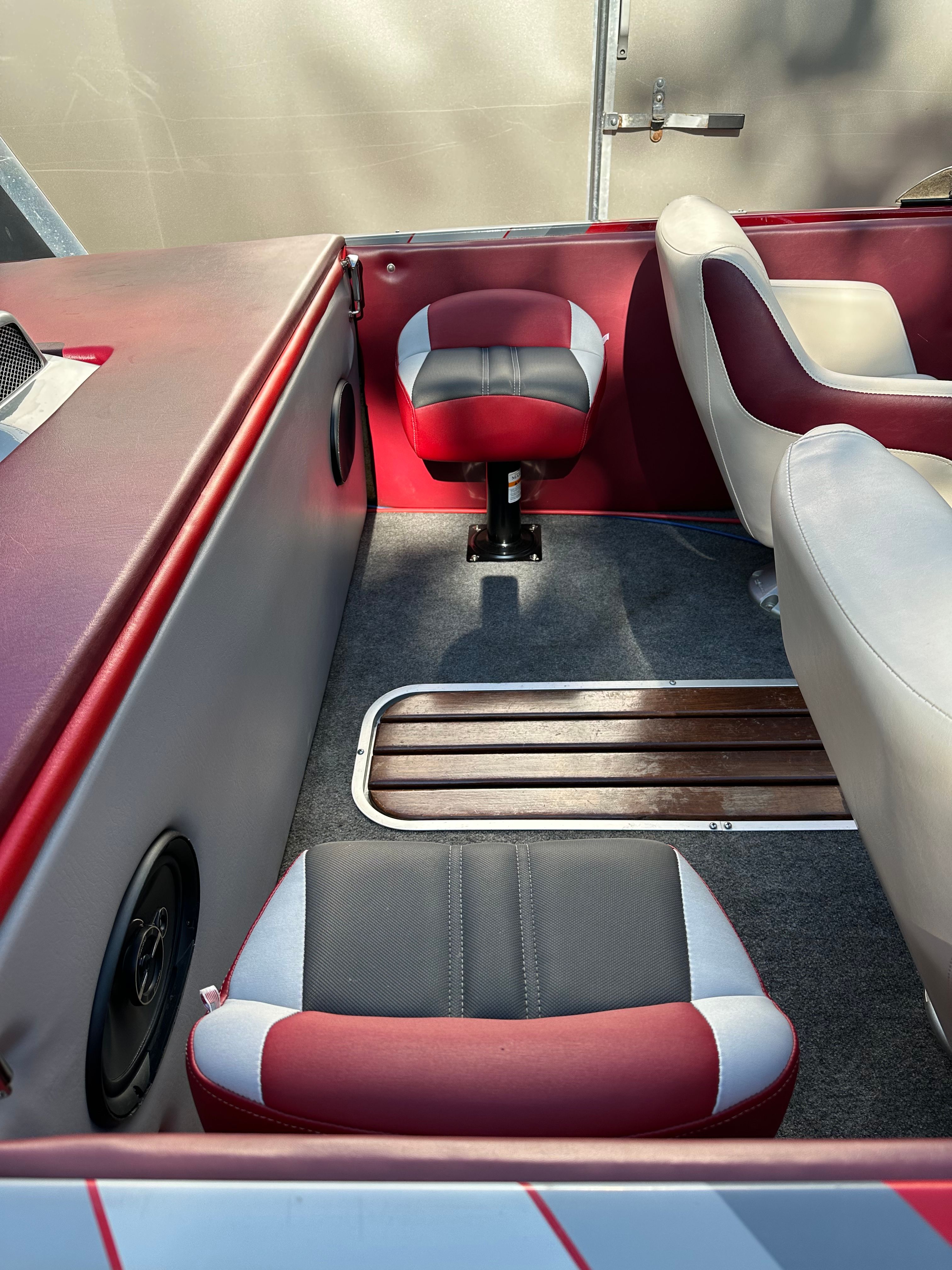 Interior of a 1989 custom jet boat with red and white seating.