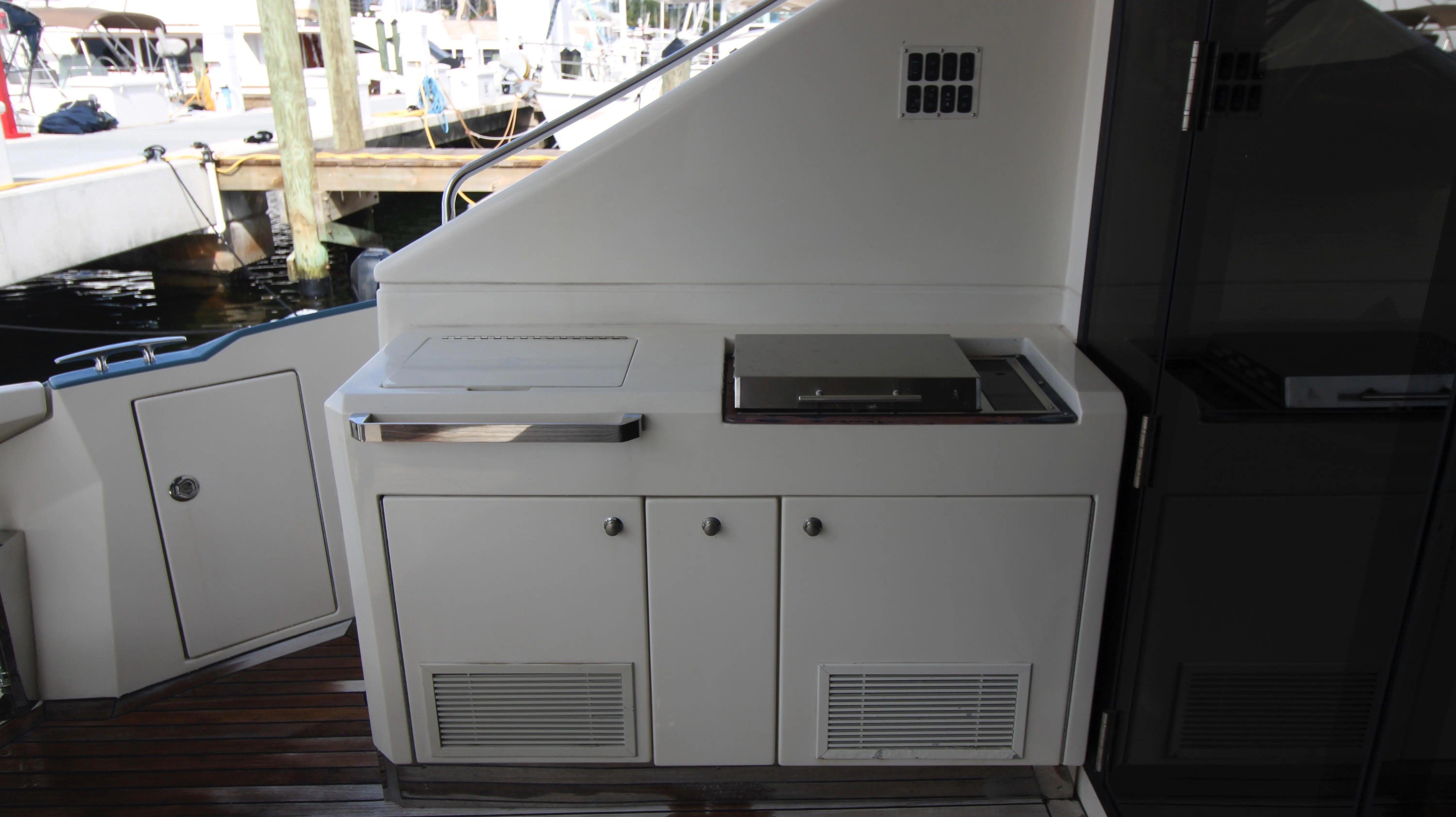 The 2010 Marquis Sport Coupe features an outdoor kitchen with a grill and storage space.