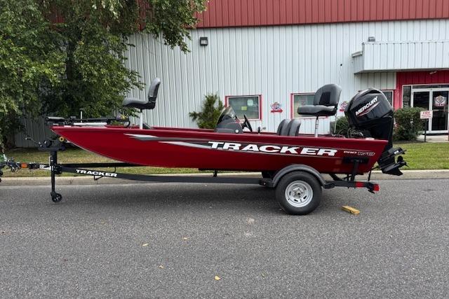 2026 Tracker Pro 170 boat in red, parked outdoors on a trailer.