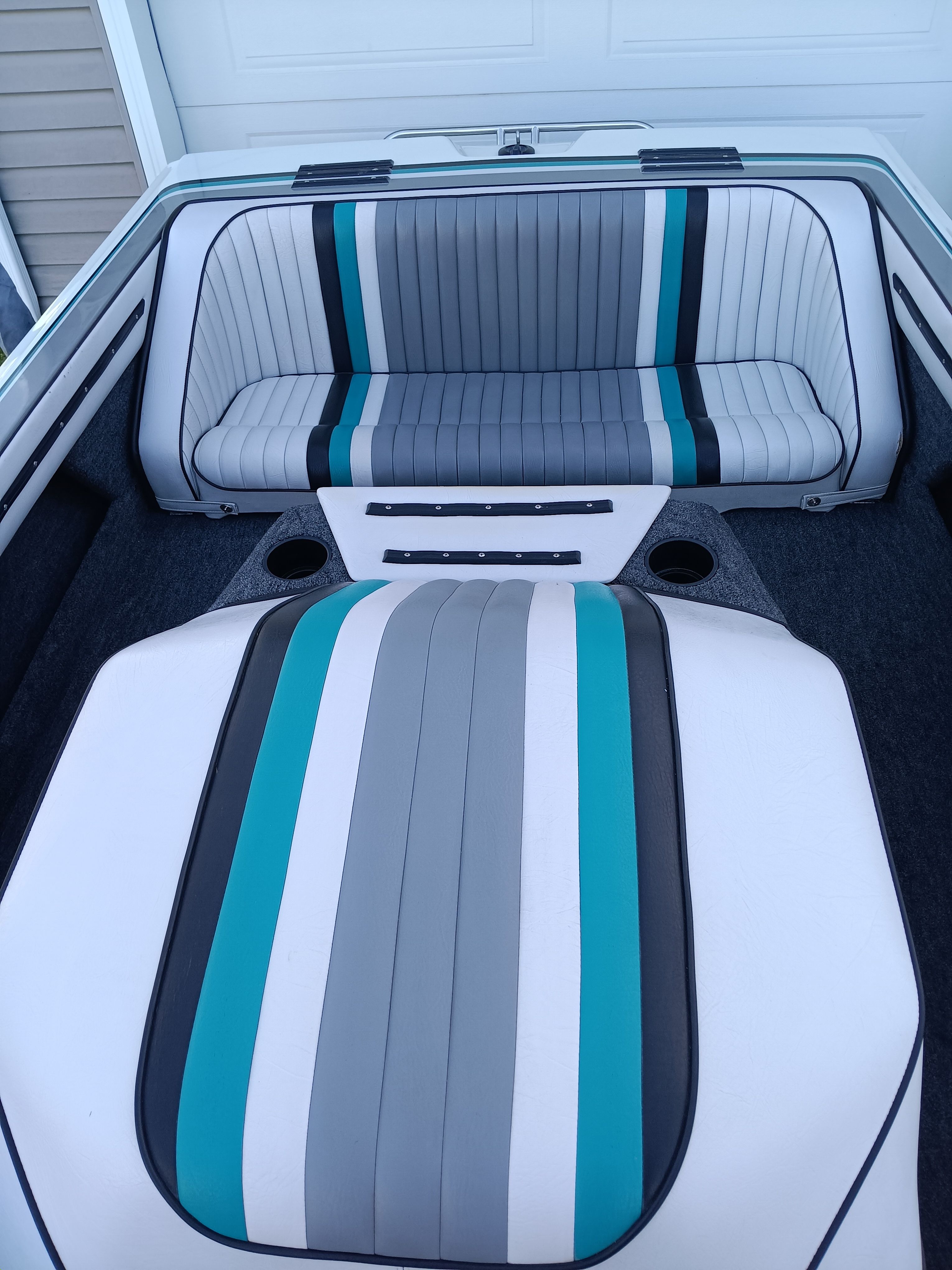 Interior of a 1991 Malibu Skier with striped seats.