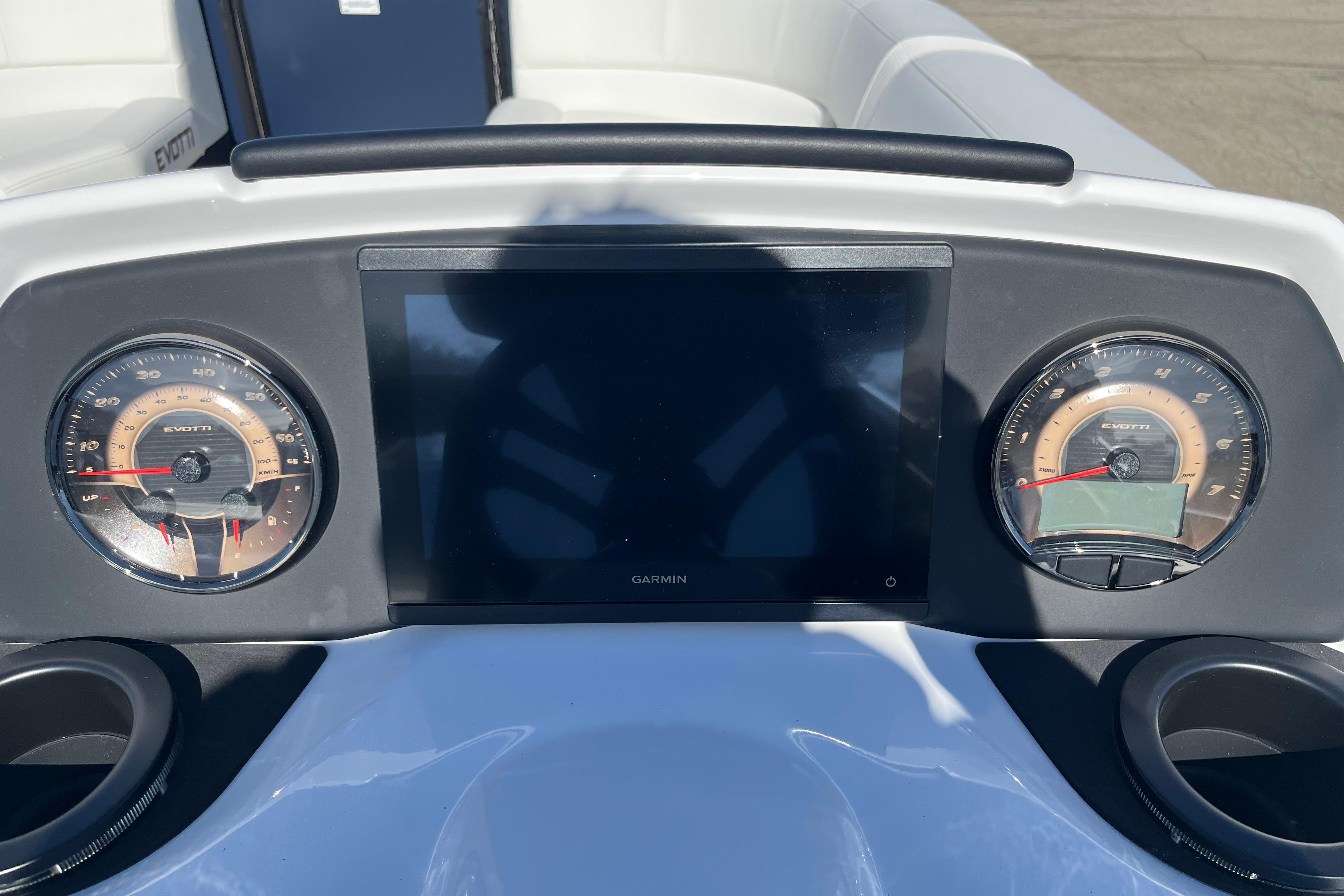Dashboard of 2026 Evotti 523CS boat with gauges and Garmin display.