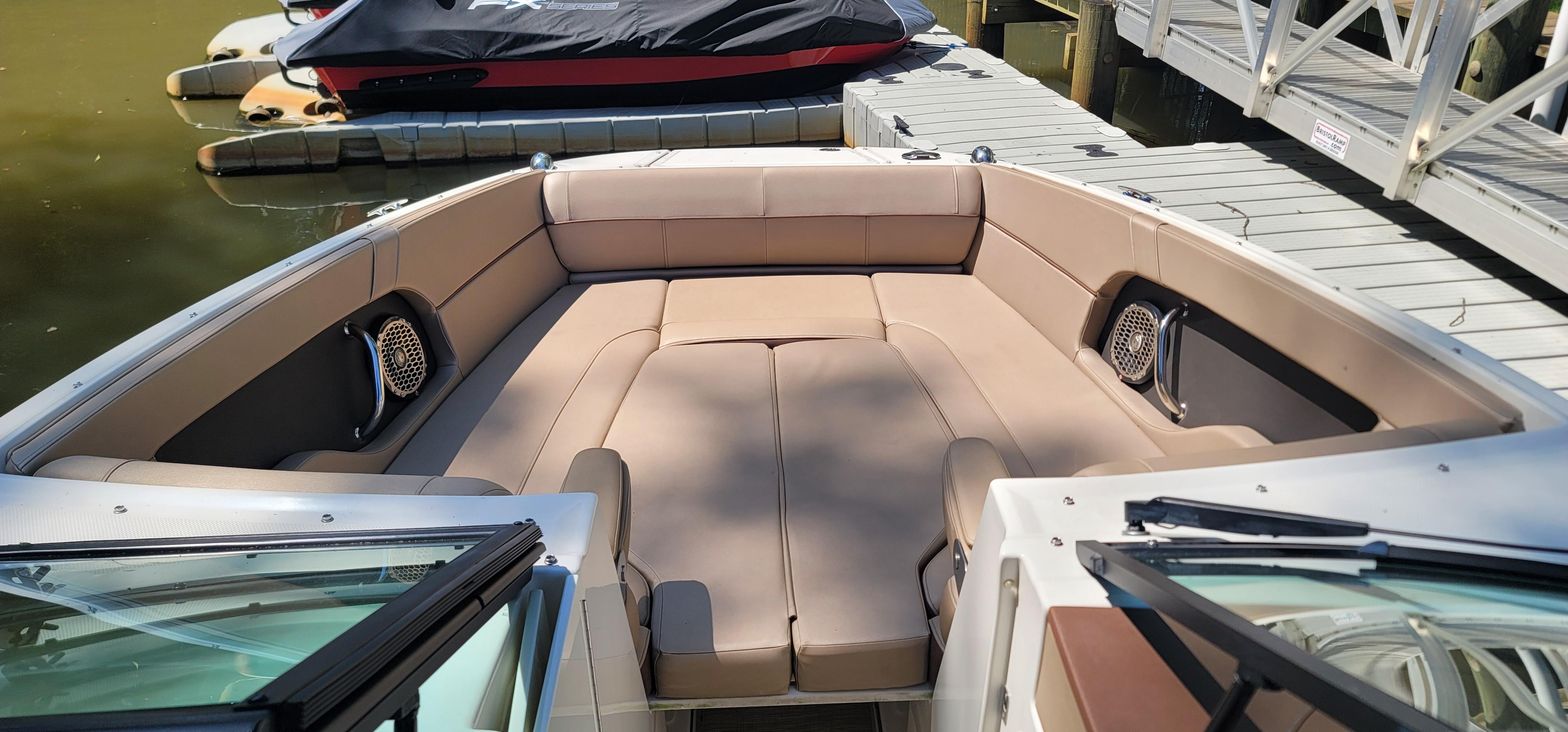 2017 Sea Ray SDX 240 Outboard boat with spacious seating at dock.