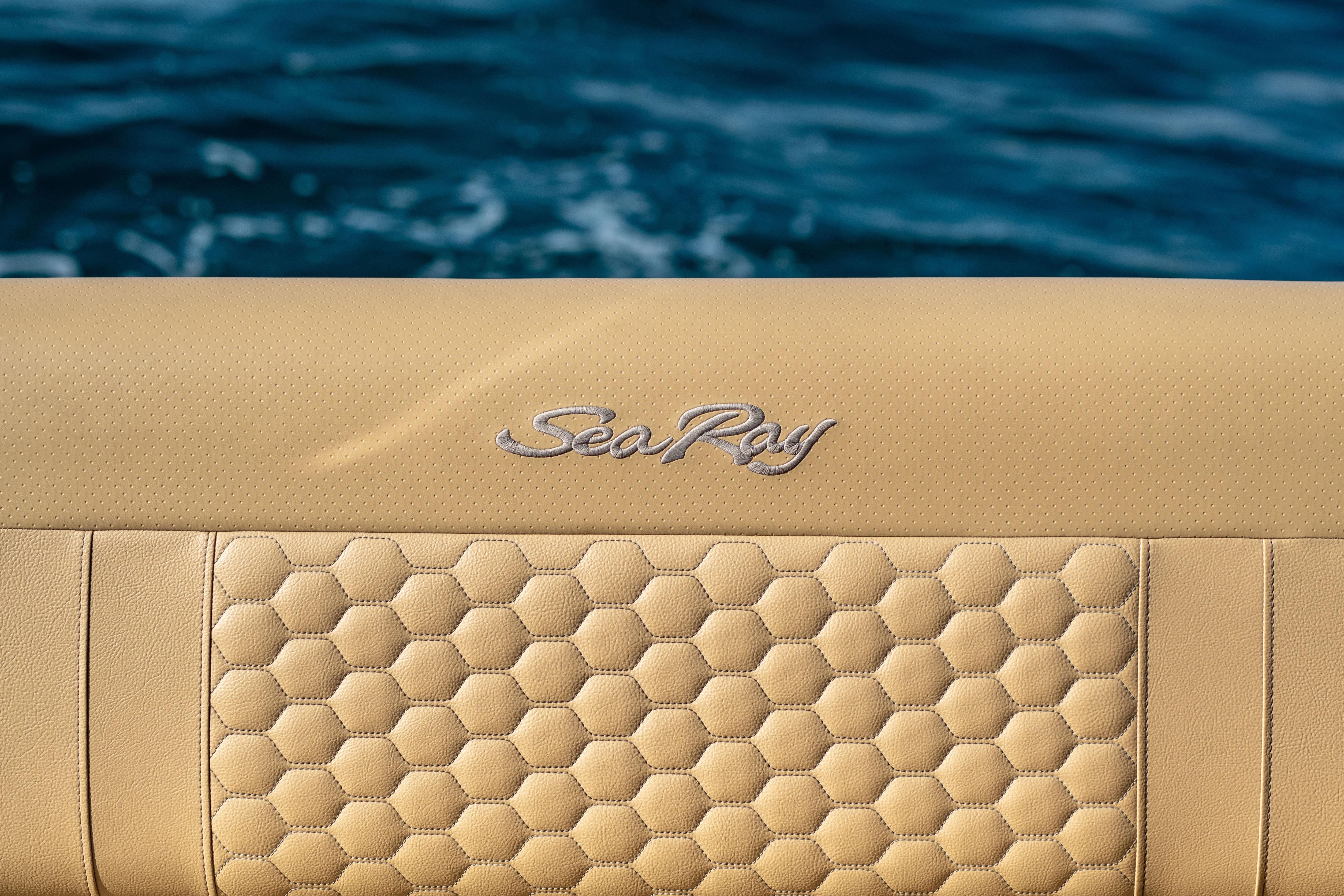 2022 Sea Ray Sundancer 320 boat seat with honeycomb pattern, ocean background.