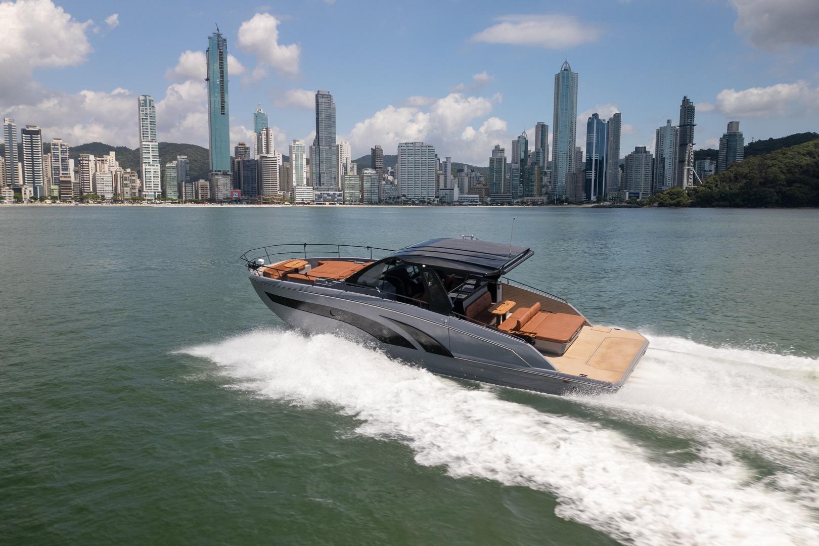 Luxury Hanover 447 yacht cruising near city skyline, 2026 model.