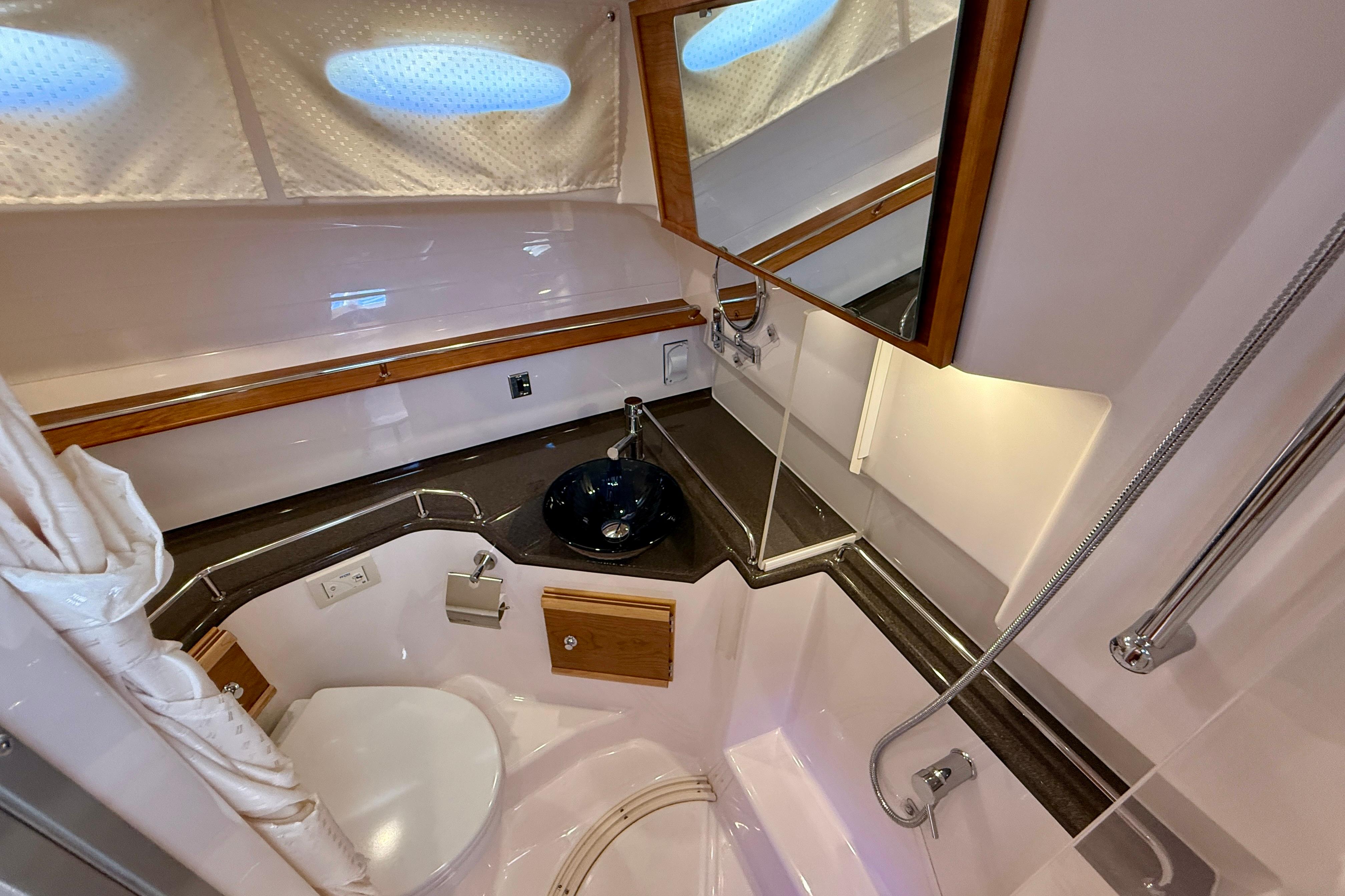 2023 Cutwater C-30 Sedan bathroom with modern fixtures and compact design.