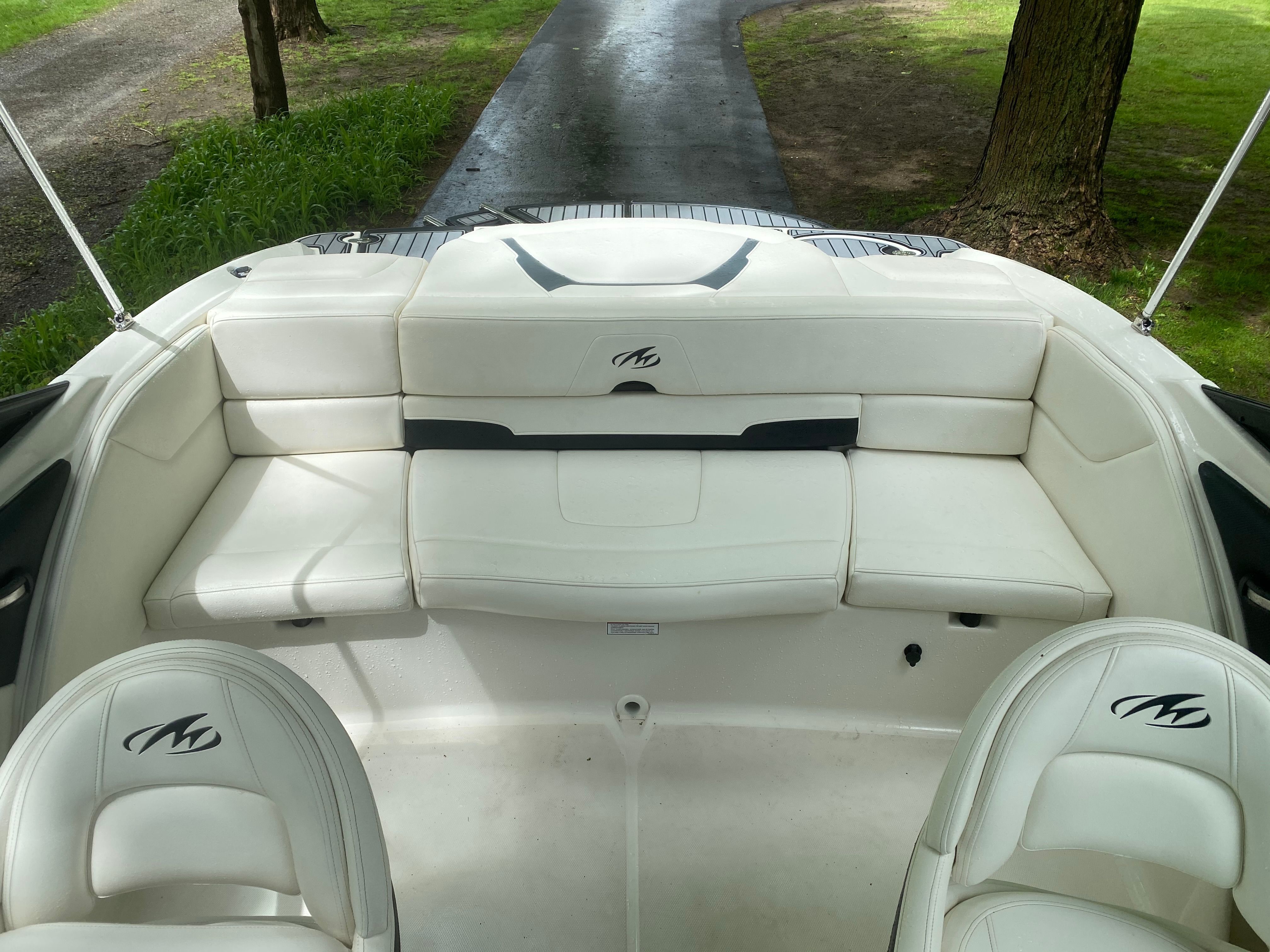 Interior of a 2013 Monterey 204FSX boat with white seating.