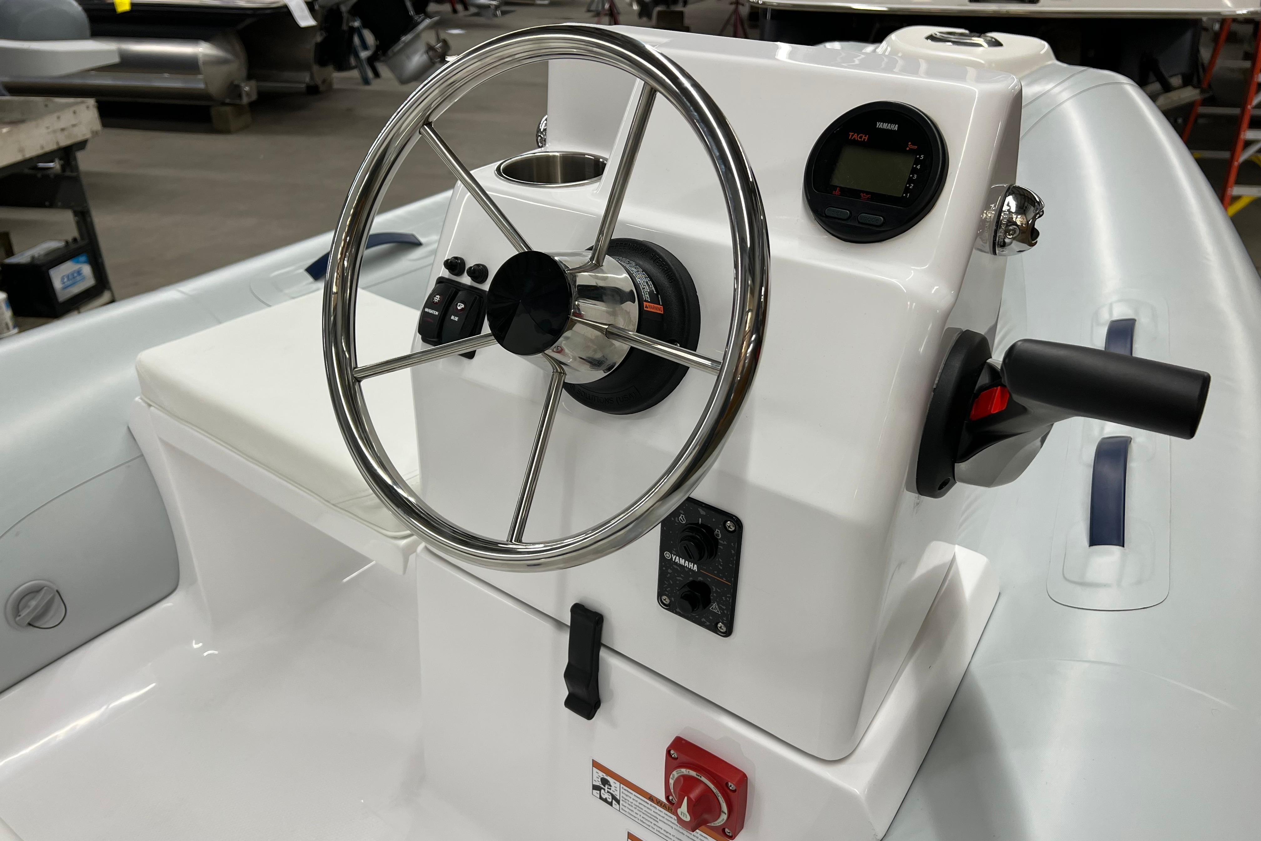 2023 AB Inflatables Mares 11 VSX boat console with steering wheel and controls.