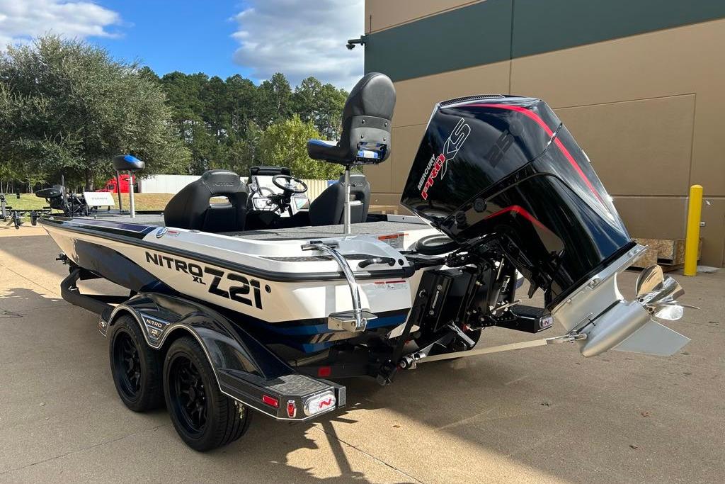 2026 Nitro Z21 XL Pro boat with powerful outboard motor, parked outdoors.