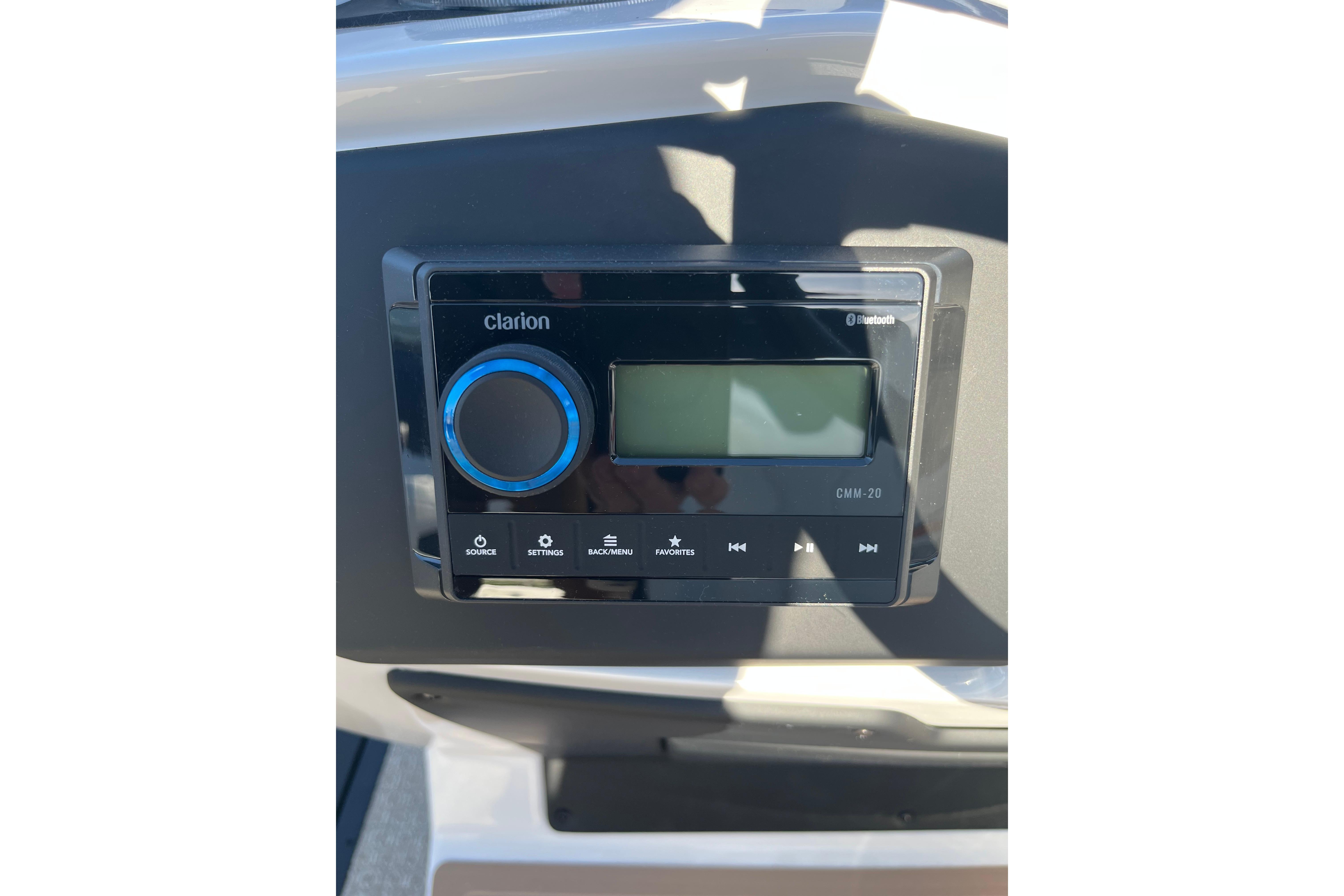 Dashboard of 2026 Evotti 523CS featuring Clarion CMM-20 Bluetooth audio system.